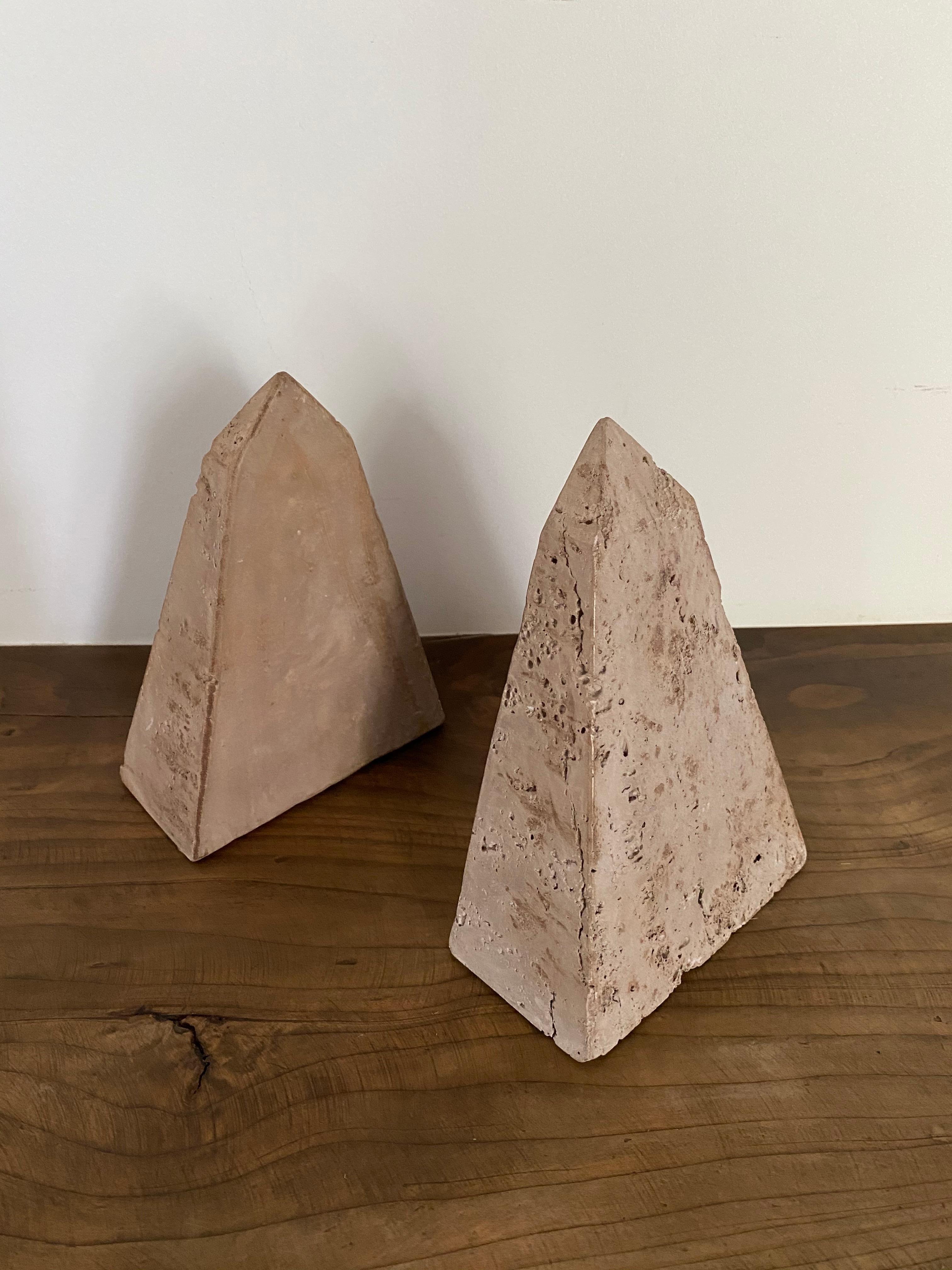 A pair of triangular/geometric travertine bookends from Italy.