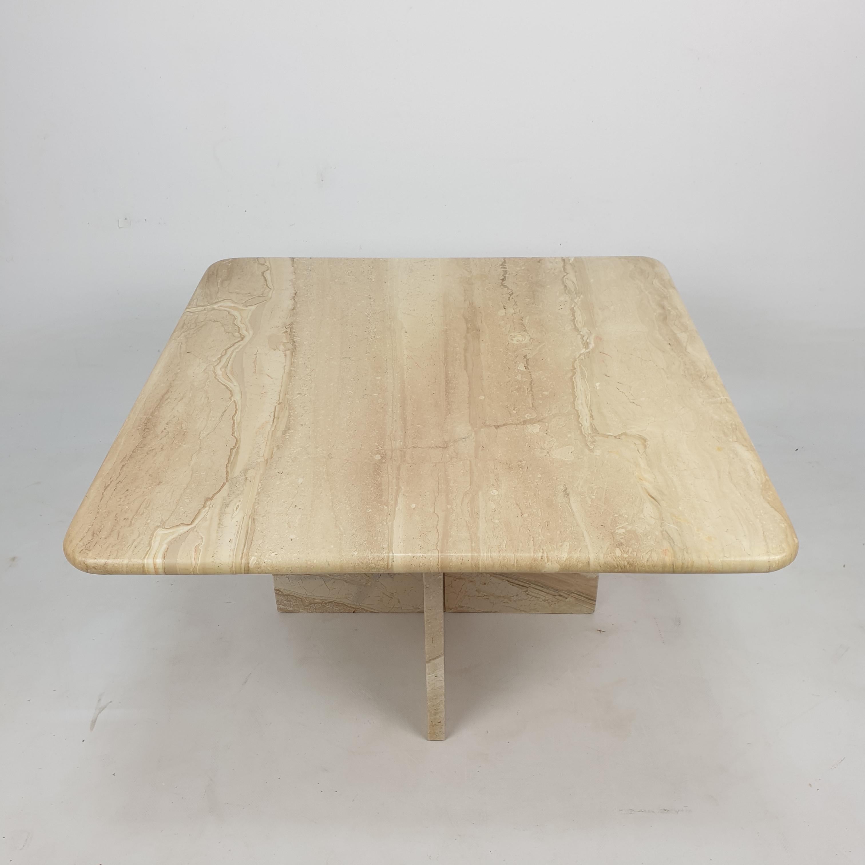 Very nice Italian coffee table from the 80's, handcrafted out of travertine. The top is rounded on the edge. This stunning table will make the perfect addition to any seating or living room decor for years to come.