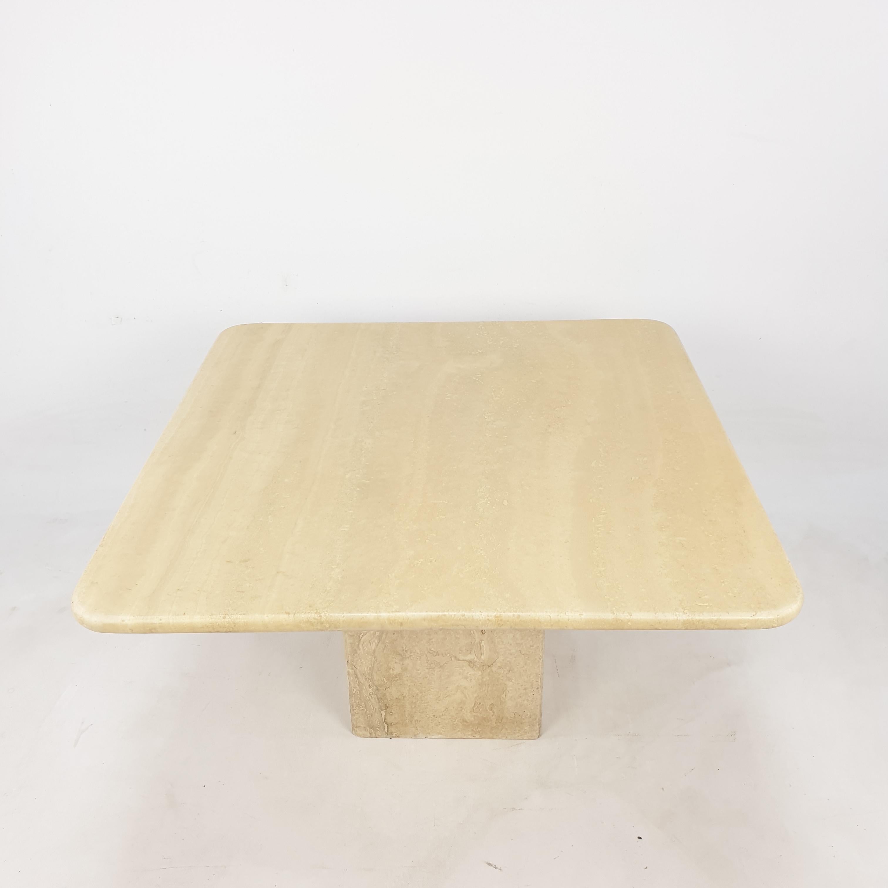 Very nice Italian coffee table from the 80's, handcrafted out of travertine. The top is rounded on the edge. This stunning table will make the perfect addition to any seating or living room decor for years to come.