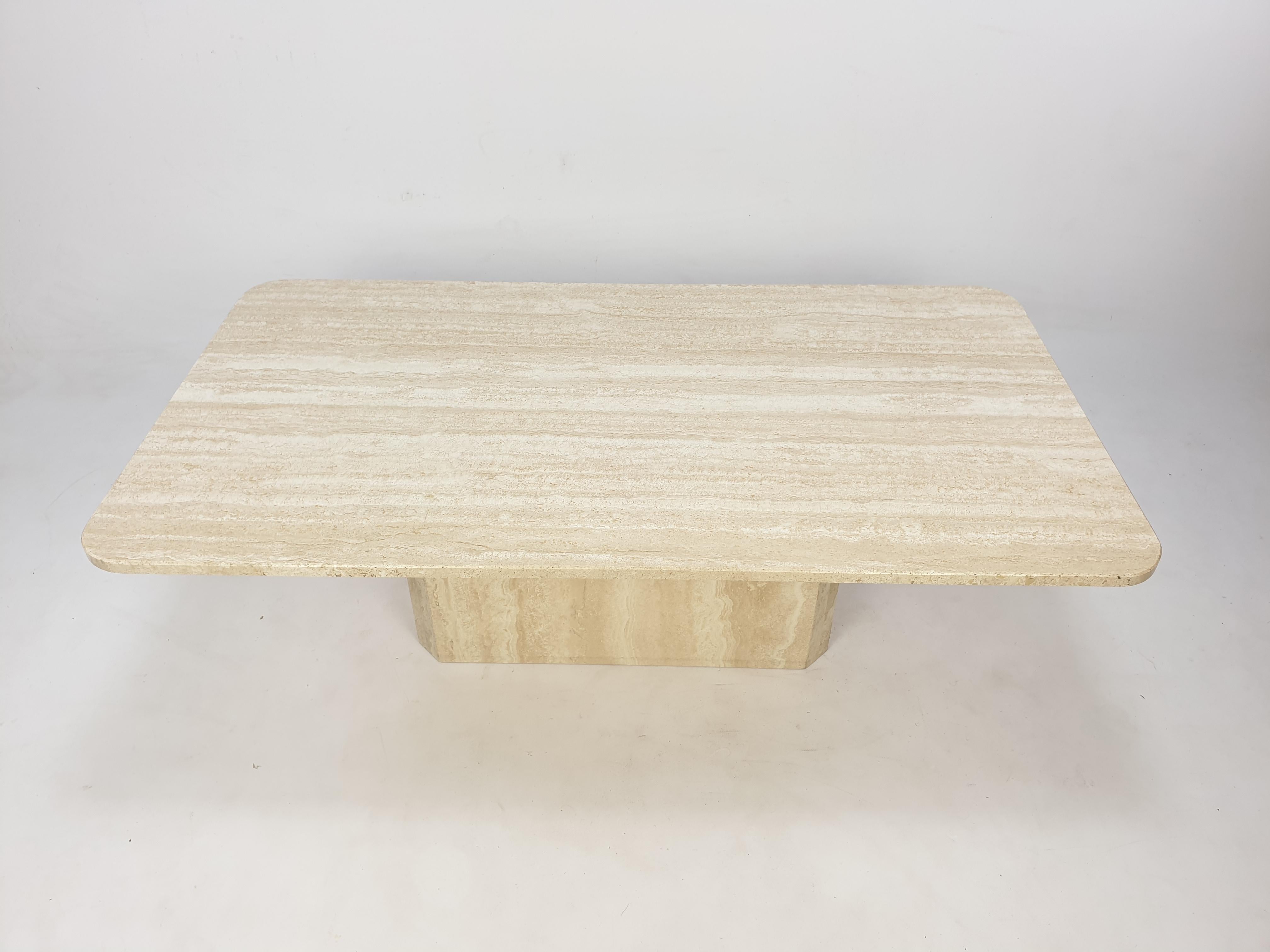 Very nice Italian coffee table from the 80's, handcrafted out of travertine. This stunning table will make the perfect addition to any seating or living room decor for years to come.