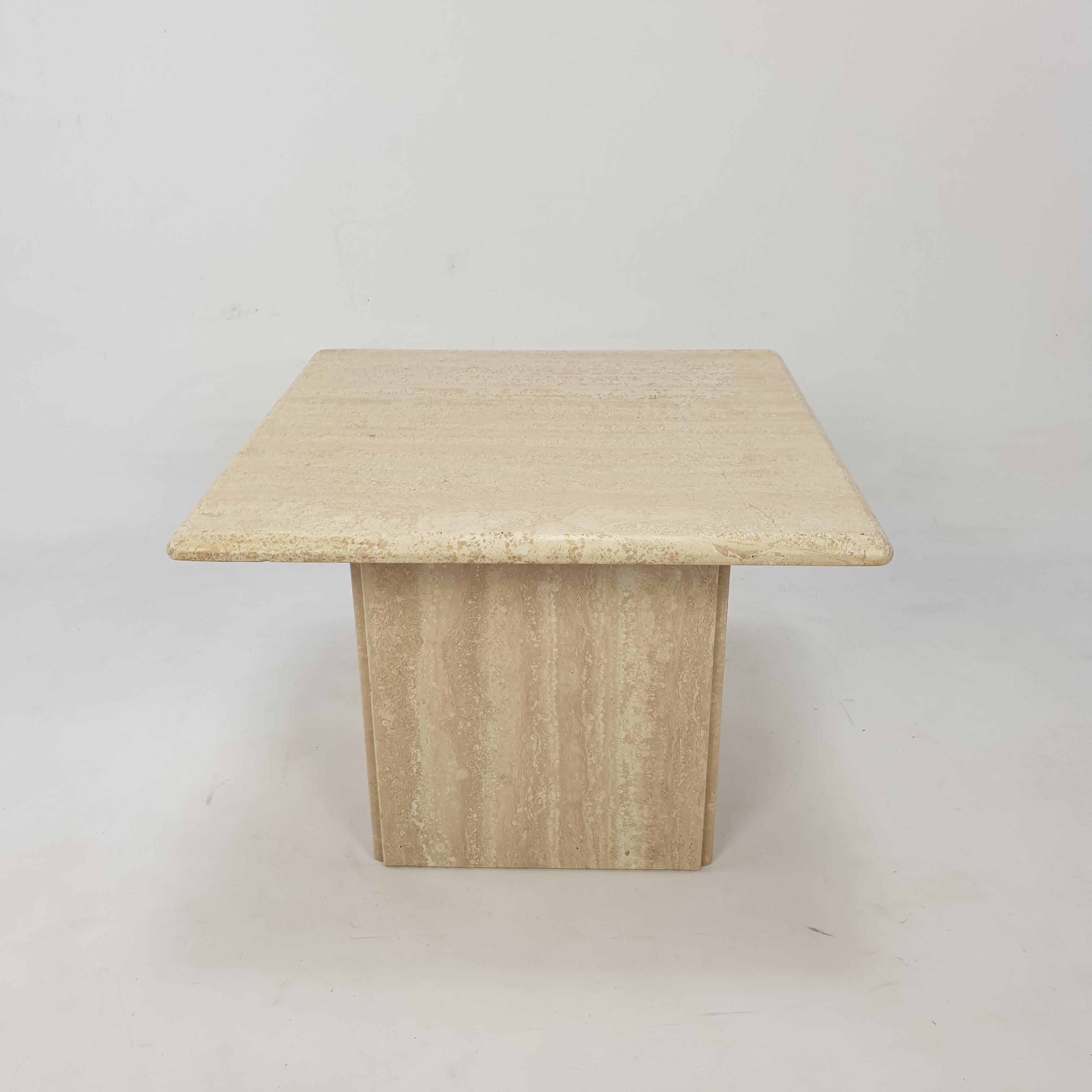 Very nice Italian coffee table handcrafted out of travertine. 

It has a beautiful top and a square base, they can be separated.

It is fabricated in the early 80's.