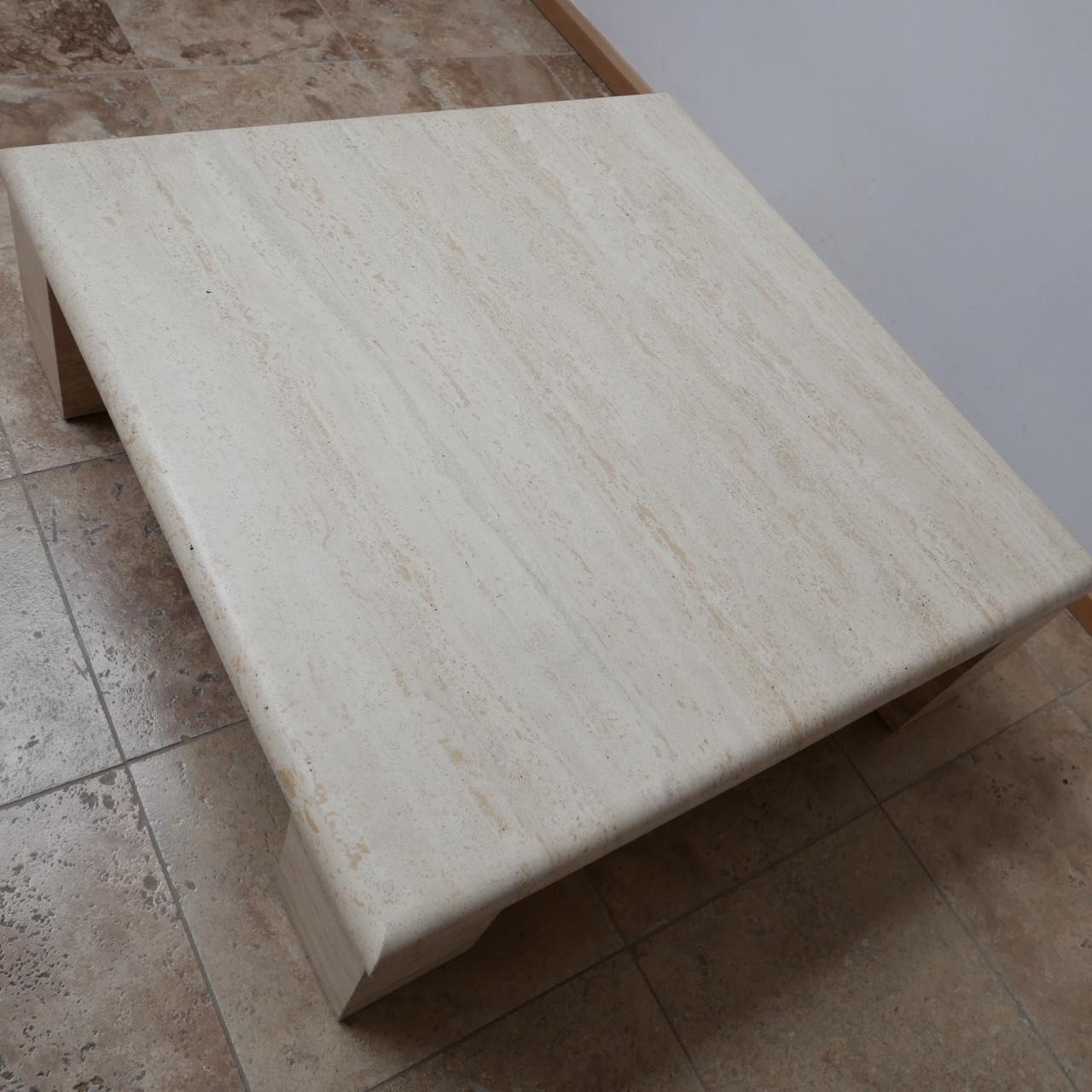 A large travertine coffee table in a similar manner to Up&Up.

A large central slab over four movable square legs.

Italian, circa 1960s.

The top is in perfect condition, the legs have some small nicks which are generally not