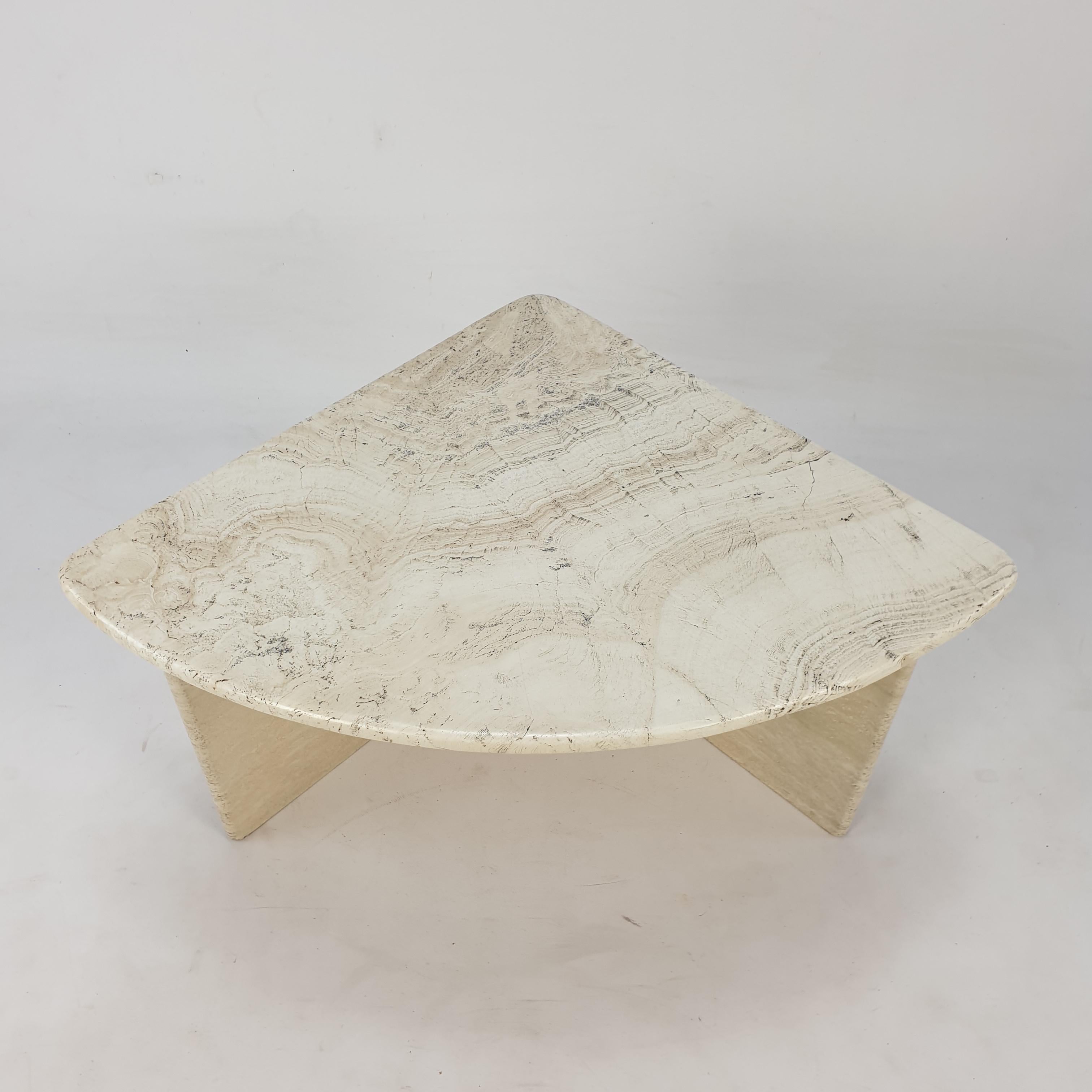Very nice Italian Coffee Table from the 80's, handcrafted out of travertine. It is possible to make a round table with 4 of these sections. The top is rounded on the edge. This stunning table will make the perfect addition to any seating or living