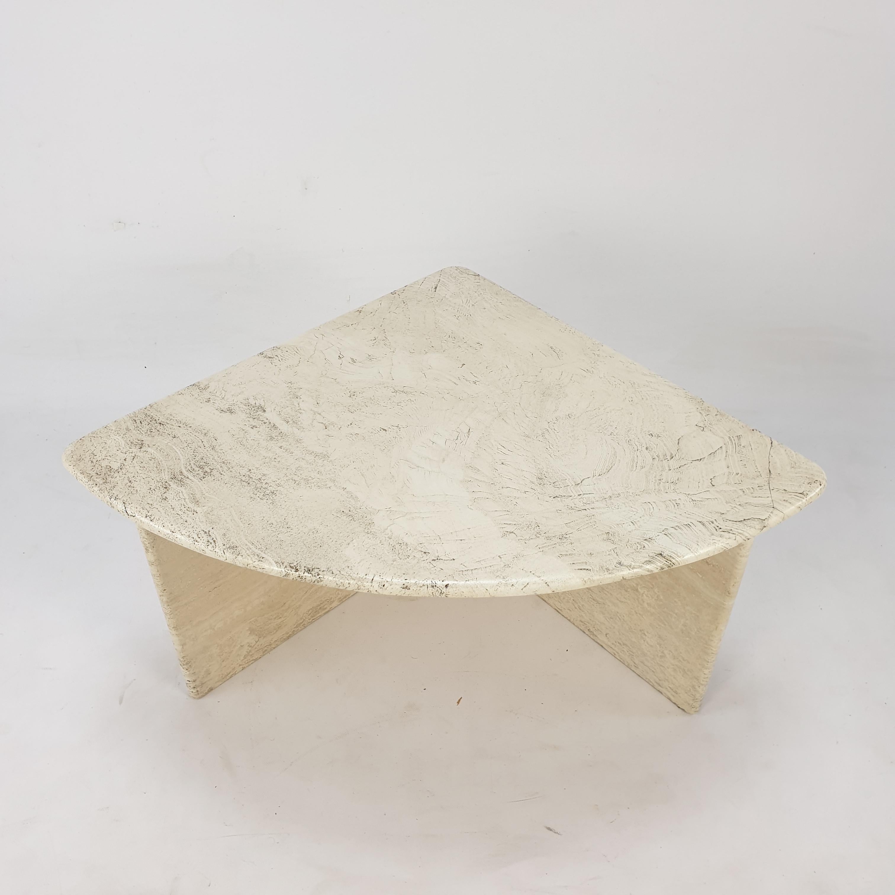 Very nice Italian coffee table from the 80's, handcrafted out of travertine. It is possible to make a round table with 4 of these sections. The top is rounded on the edge. This stunning table will make the perfect addition to any seating or living