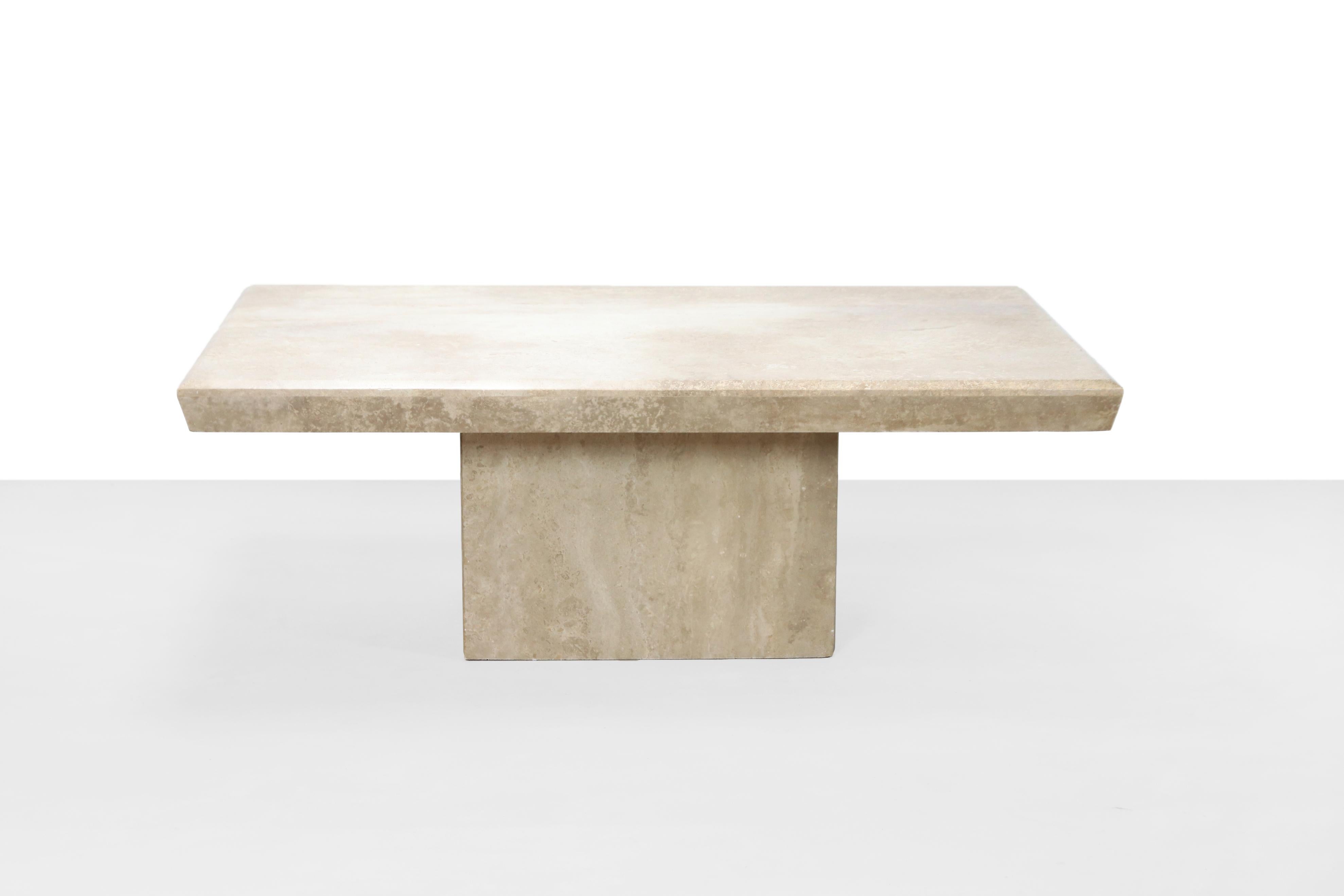 Rectangular coffee table from Italian Travertine.
Beautiful solid table with a very nice and sophisticated look and feel, because the travertine has a rich, active grain.
This piece is most likely from the 1970s.