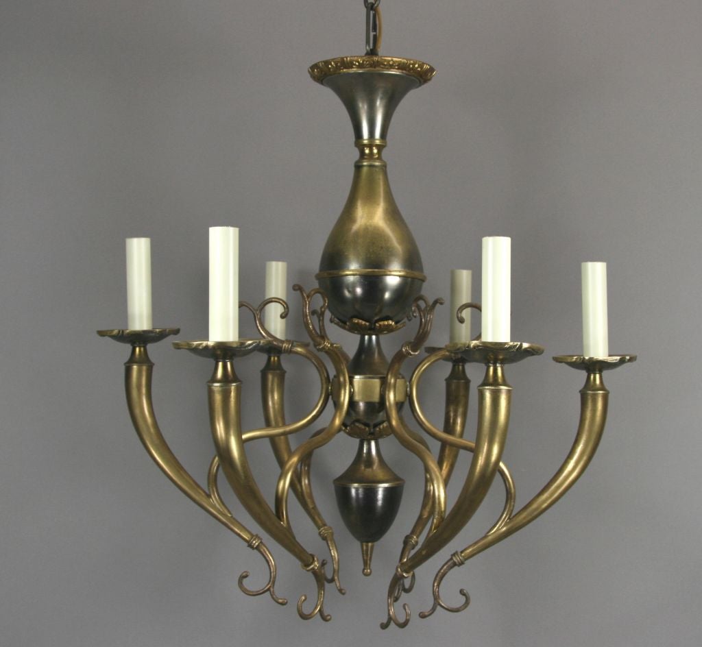 #1-4003 Italian scrolled six-arm chandelier in a nickel and brass finish.
 