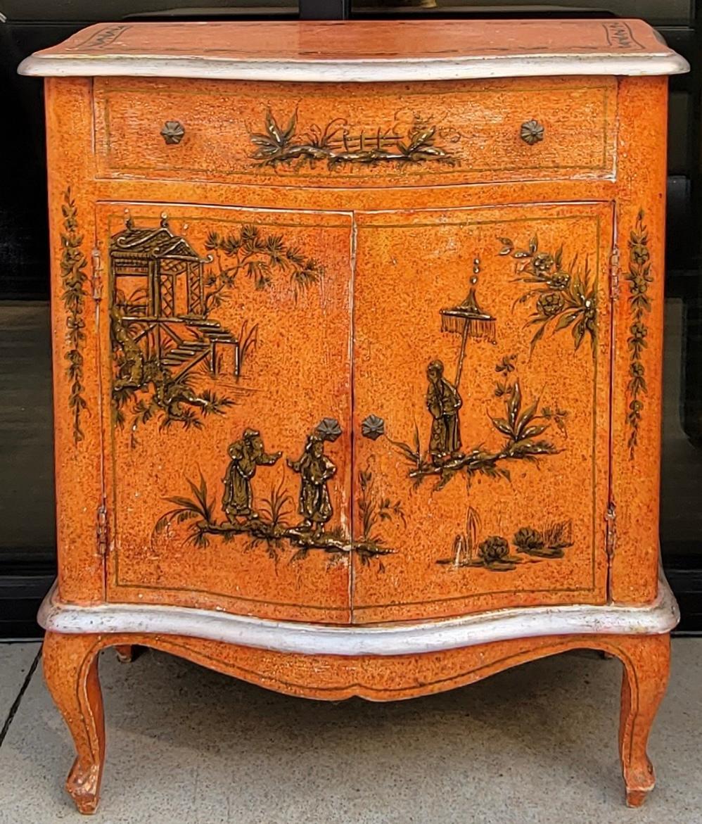 I love this sweet little Venetian cabinet! It is Orange with gilt chinoiserie that is hand painted, and a sort of platinum trim. The interior is a soft blue. The piece is a single drawer over two doors. It is marked.

My shipping is for the