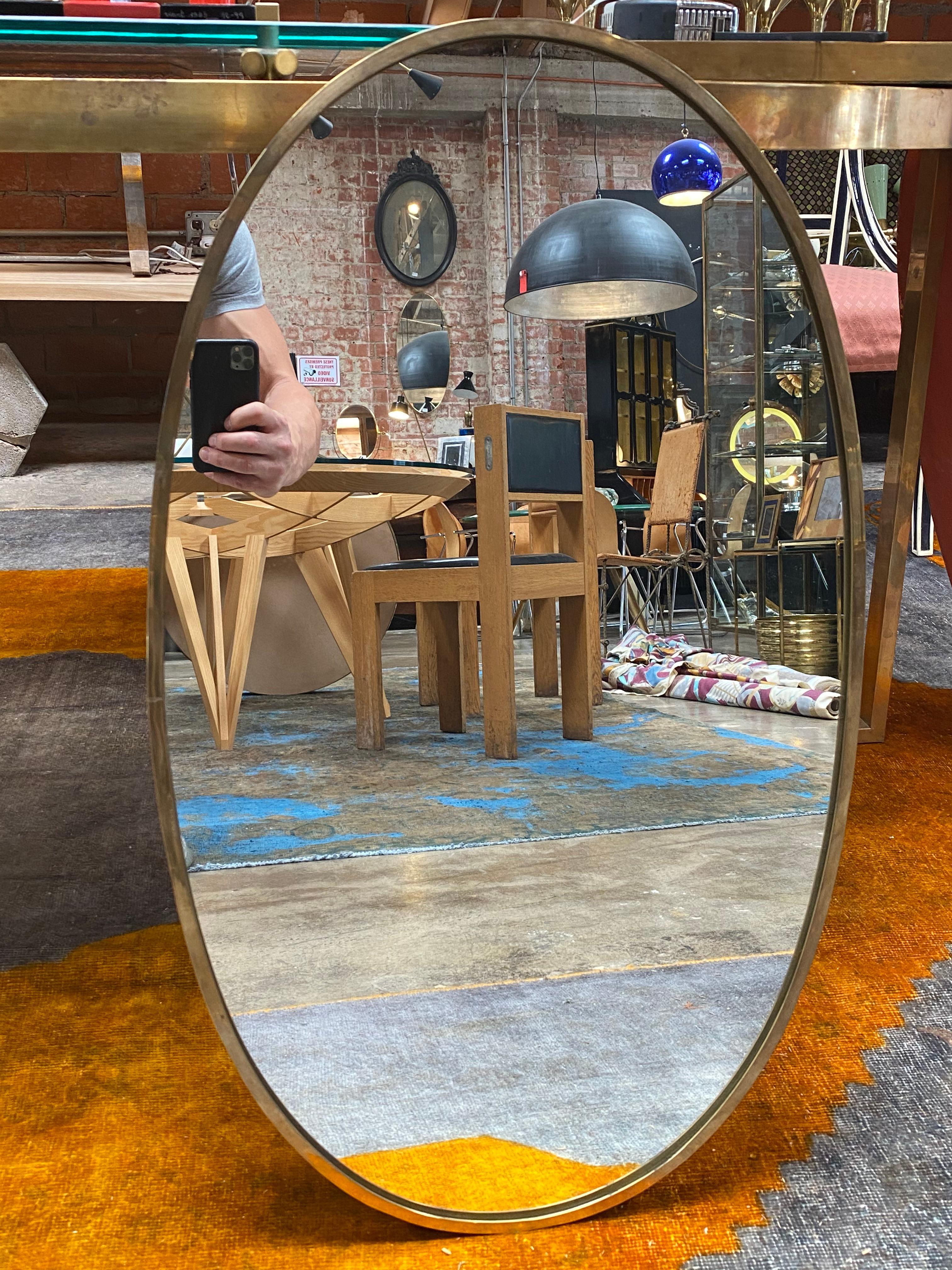 Mid century Italian wall mirror 1950s with a brass frame.
Available N 2 mirrors same size.