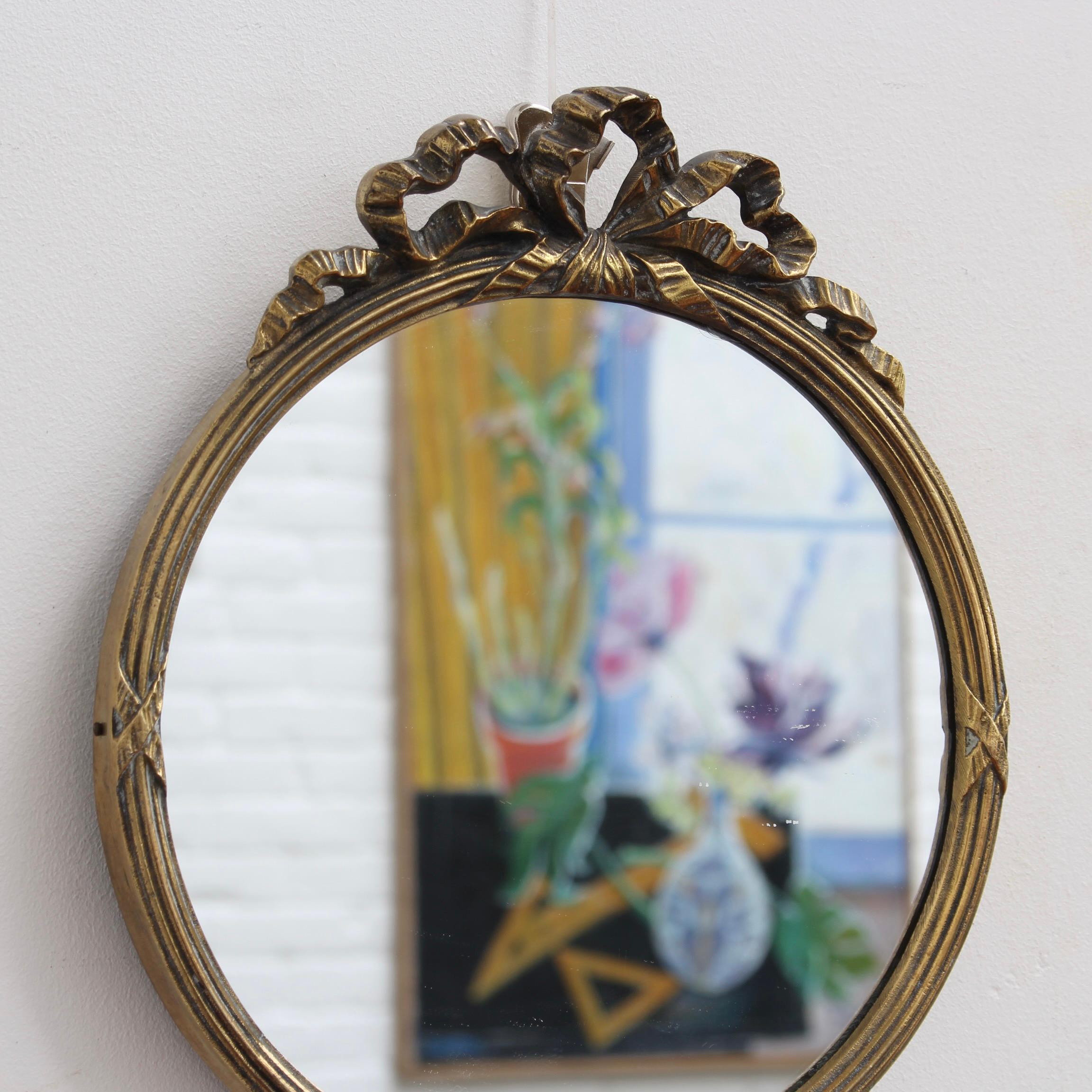 Mid-20th Century Mid-Century Italian Wall Mirror with Brass Frame and Ribbon Crest 'circa 1950s' 