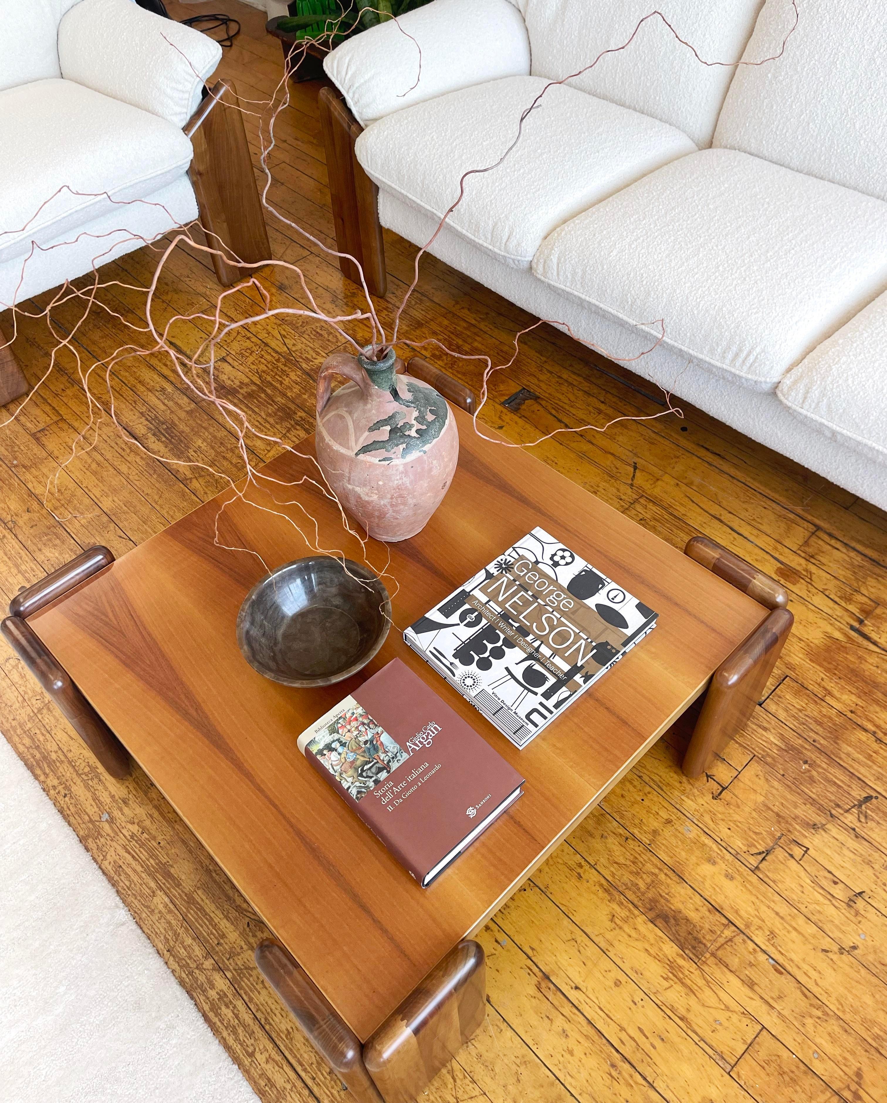 Introducing the stunning 'Sapporo' walnut coffee table, designed by the renowned Mario Marenco for Mobil Girgi in the 1970s. 

On separate listings, you can also find a matching three cushions sofa, two cushions settee, and armchair so you can