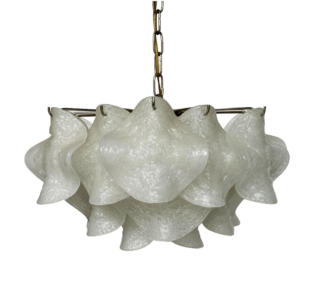 A luxurious and chic looking Italian chandelier, circa 1960s. It features hanging sculpted art glass pendants on a solid chrome-plated frame. Tested, working and ready for immediate use. Takes 4 standard size lightbulbs. 