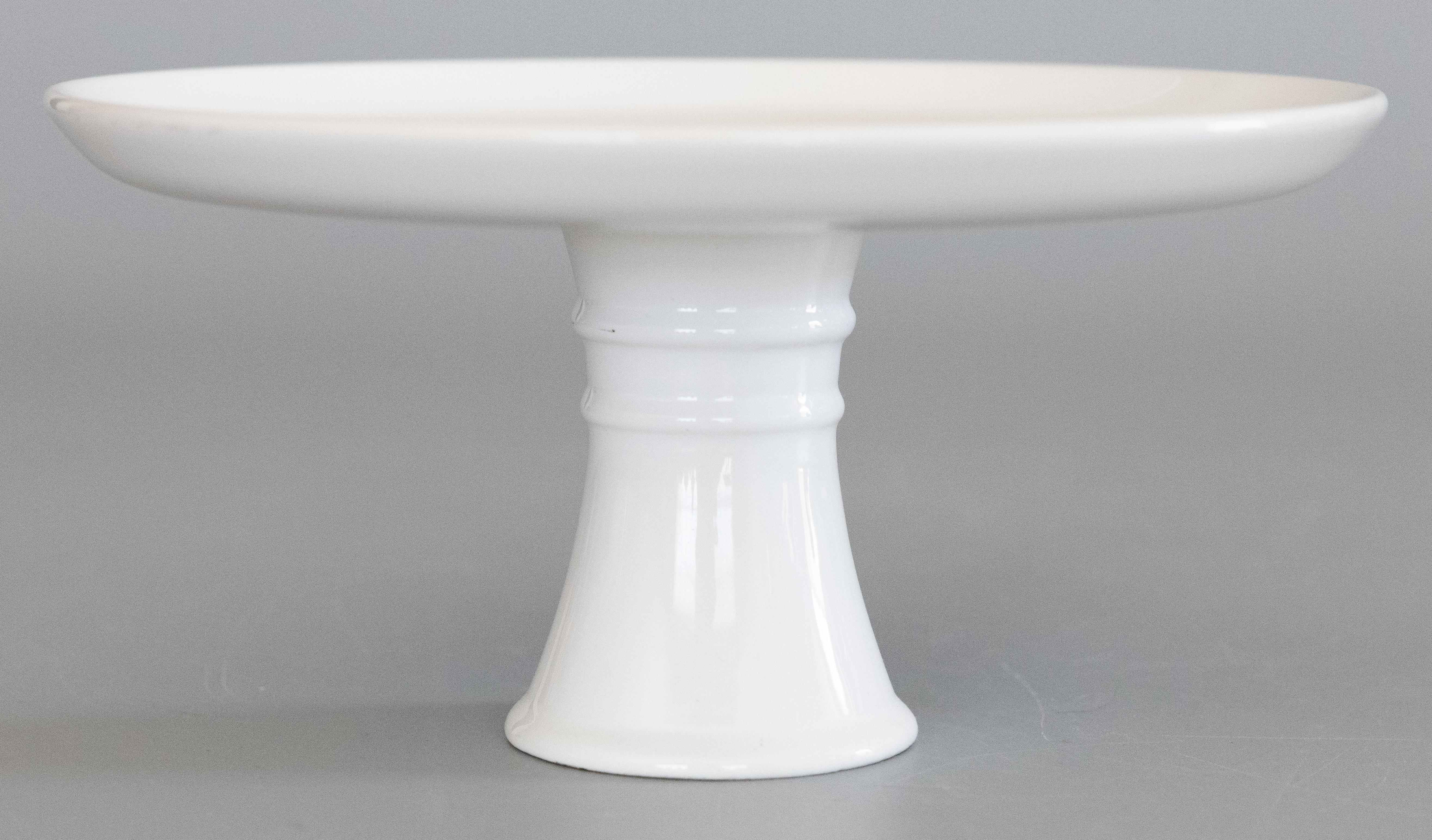 A lovely vintage Italian white ceramic cake stand on a tall pedestal, circa 1950. Marked 