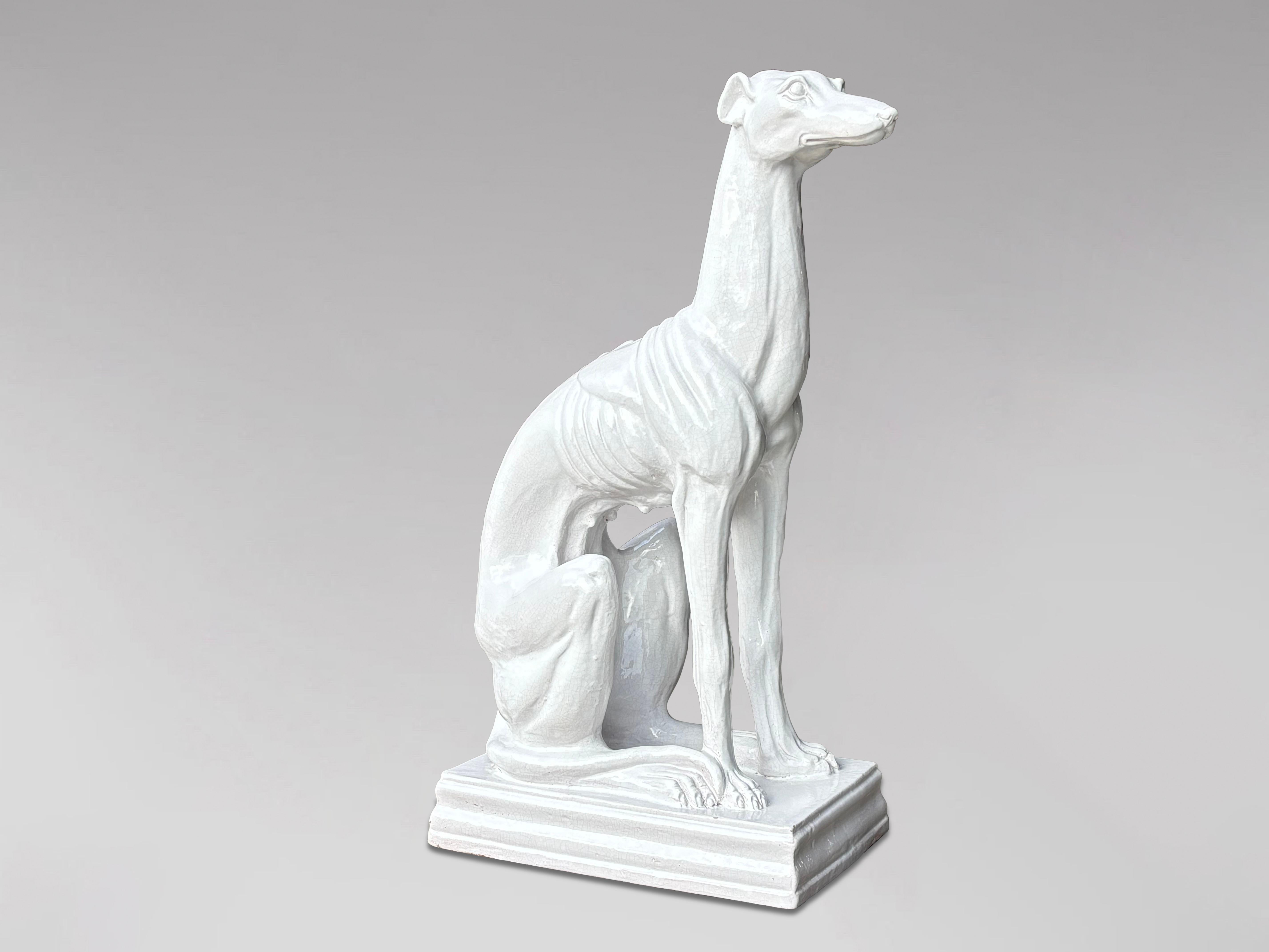 Impressive Mid-Century Italian Life-Size White Glazed Ceramic Greyhound Sculpture (1960s)

This remarkable mid-century Italian sculpture, dating from the 1960s, is a life-size depiction of a greyhound dog, crafted from white glazed ceramic. The
