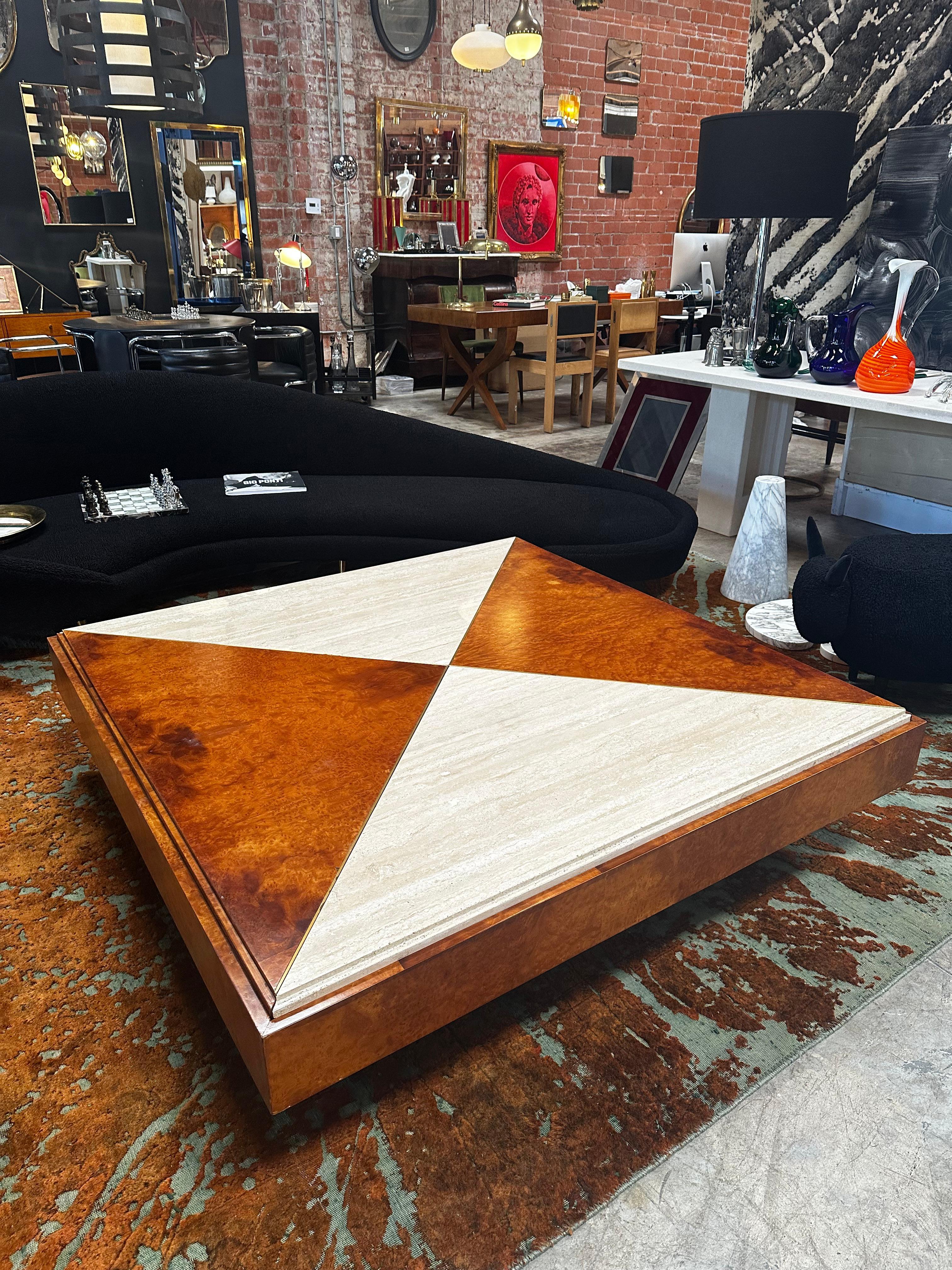 Very elegant oversize Mid-Century Modern coffee table made from marble and wood , the coffee table is in good conditions and is very exclusive since the top part is divided between white marble and wood. Nothing touches, nothing clashes, which gives