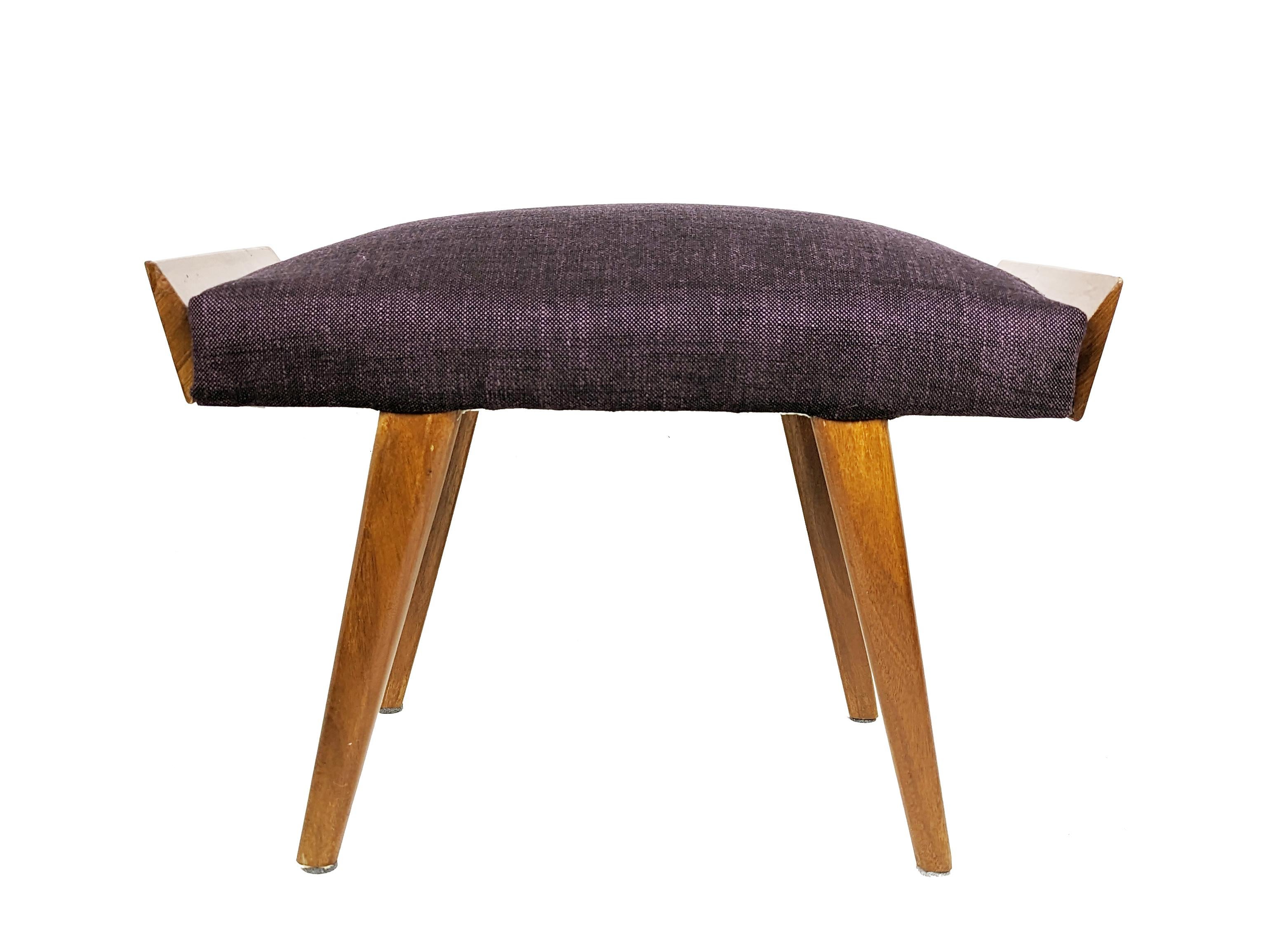 This stool features a wood frame and is reupholstered in purple fabric. Ideal as ottoman or serving stool.
Very good condition with reupholstered fabric seating. 