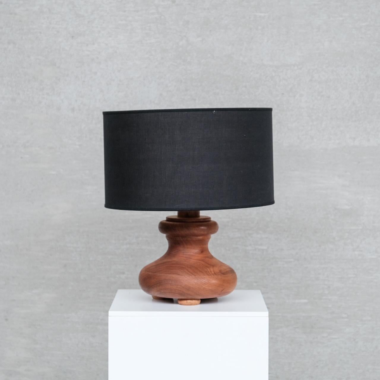 A chunky wooden table lamp. 

Italy, c1980s. 

Paired with original black shade. 

Good condition generally, some scuffs commensurate with age.

Since re-wired and PAT tested. 

PRICES ARE EXCLUSIVE OF VAT IF SOLD IN THE UK. 

Internal ref: