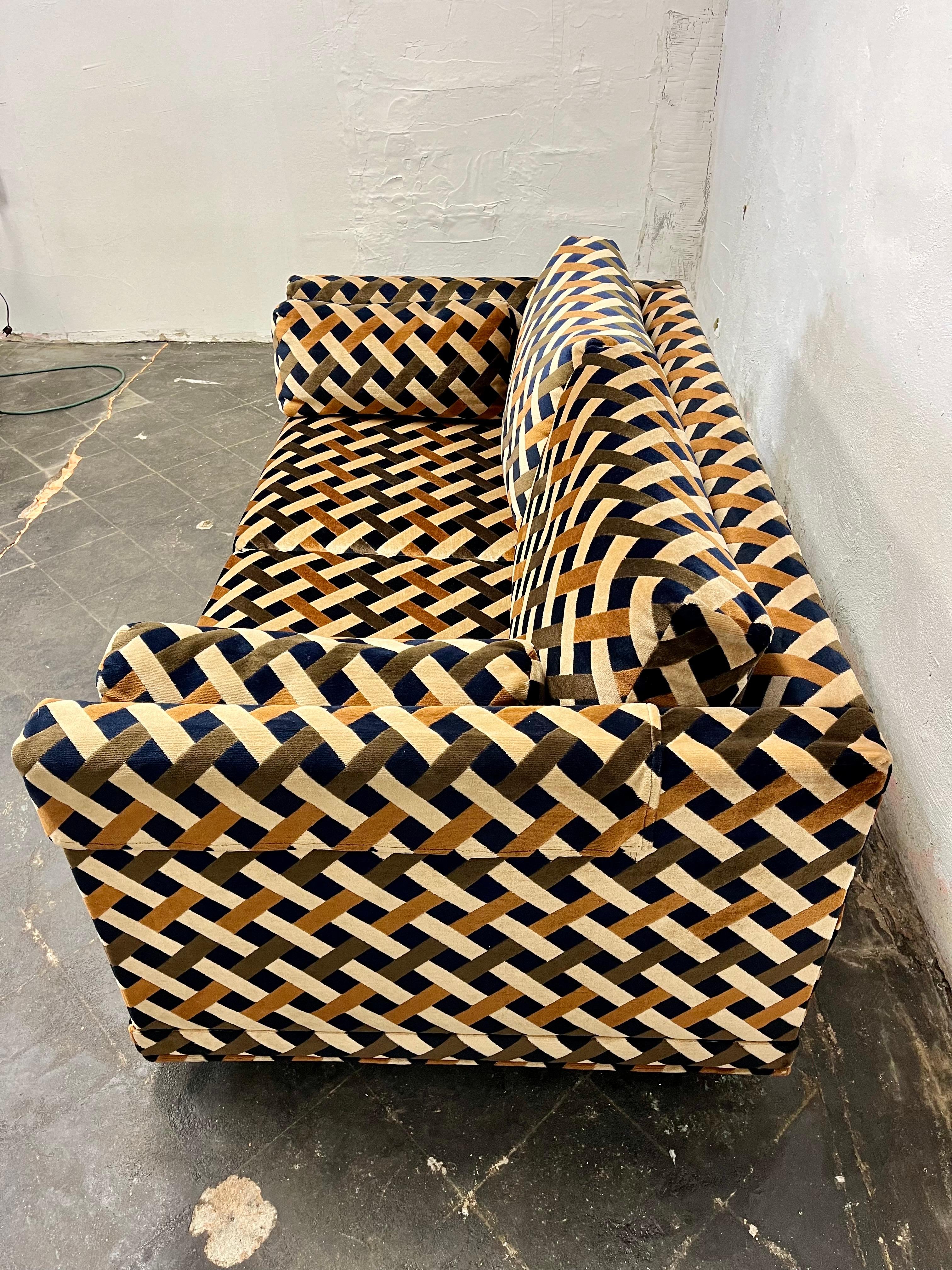 Stunning lattice or basket weave velour loveseat by Peck & Hills, NYC. Fantastic colors with browns, tan and dark navy blue that appears black in the manner of Jack Lenor Larsen. One owner purchased in 1977. Still retains arm rest covers and as good