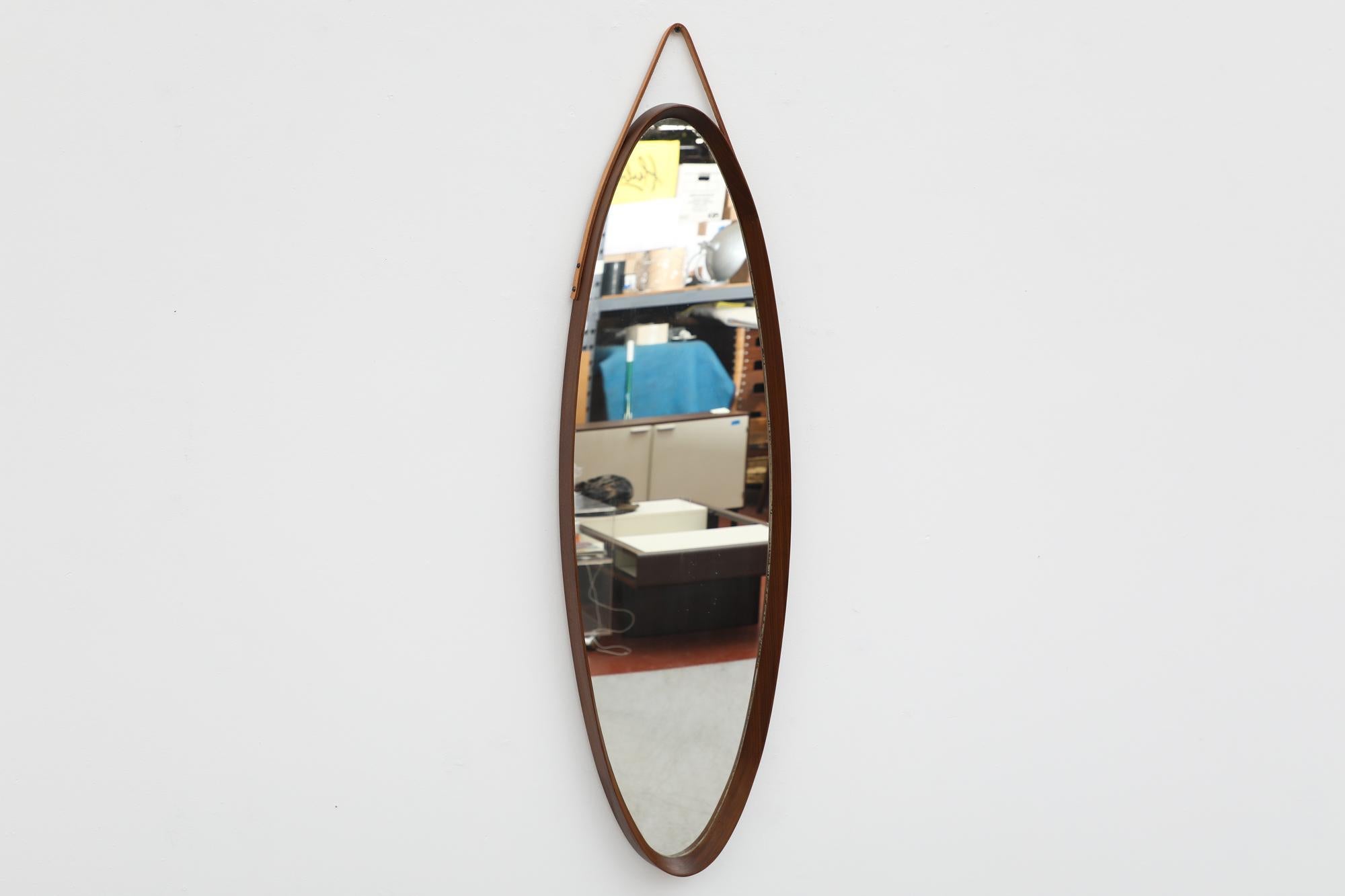 Mid-Century Jacques Adnet Inspired Oval Italian Teak Mirror with Leather Strap In Good Condition For Sale In Los Angeles, CA