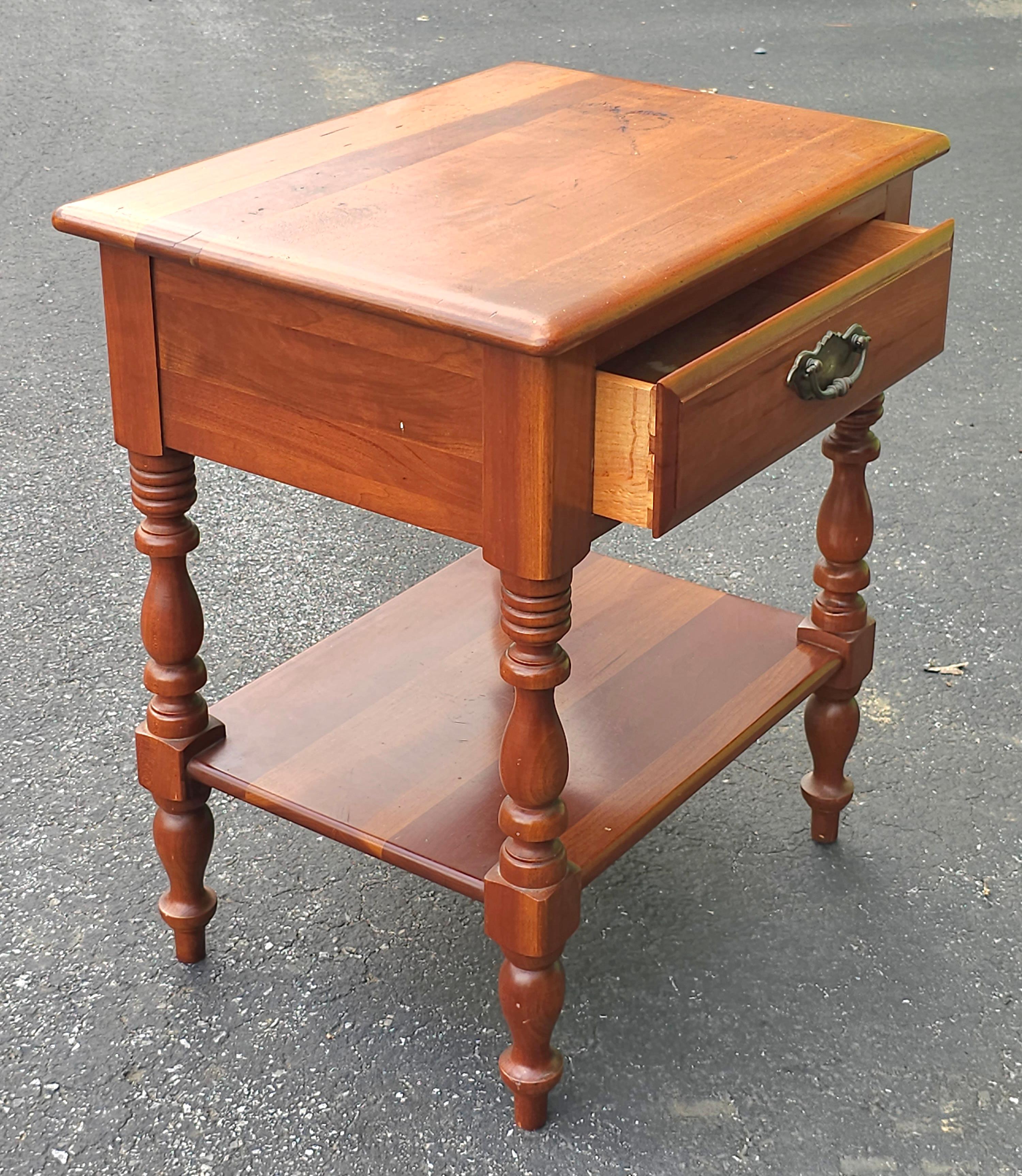 A mid Century Jamestown Furniture Maple Two Tier Single Drawer early American style Side Table. Measures 22