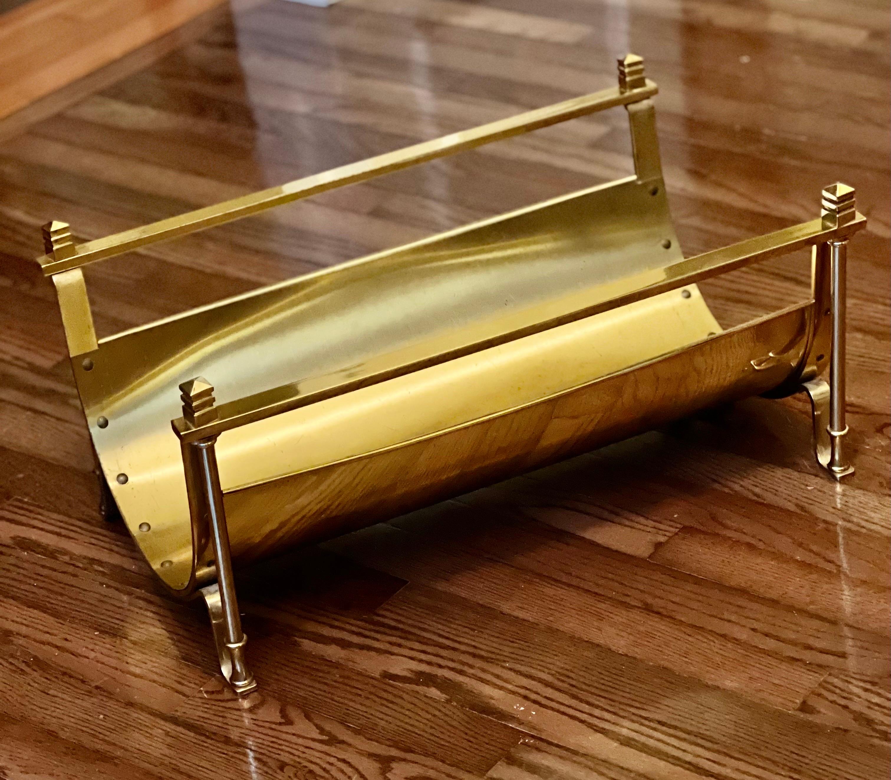 Mid-century solid brass footed log holder in the style of Maison Jansen. Elegant design with beautiful details throughout.