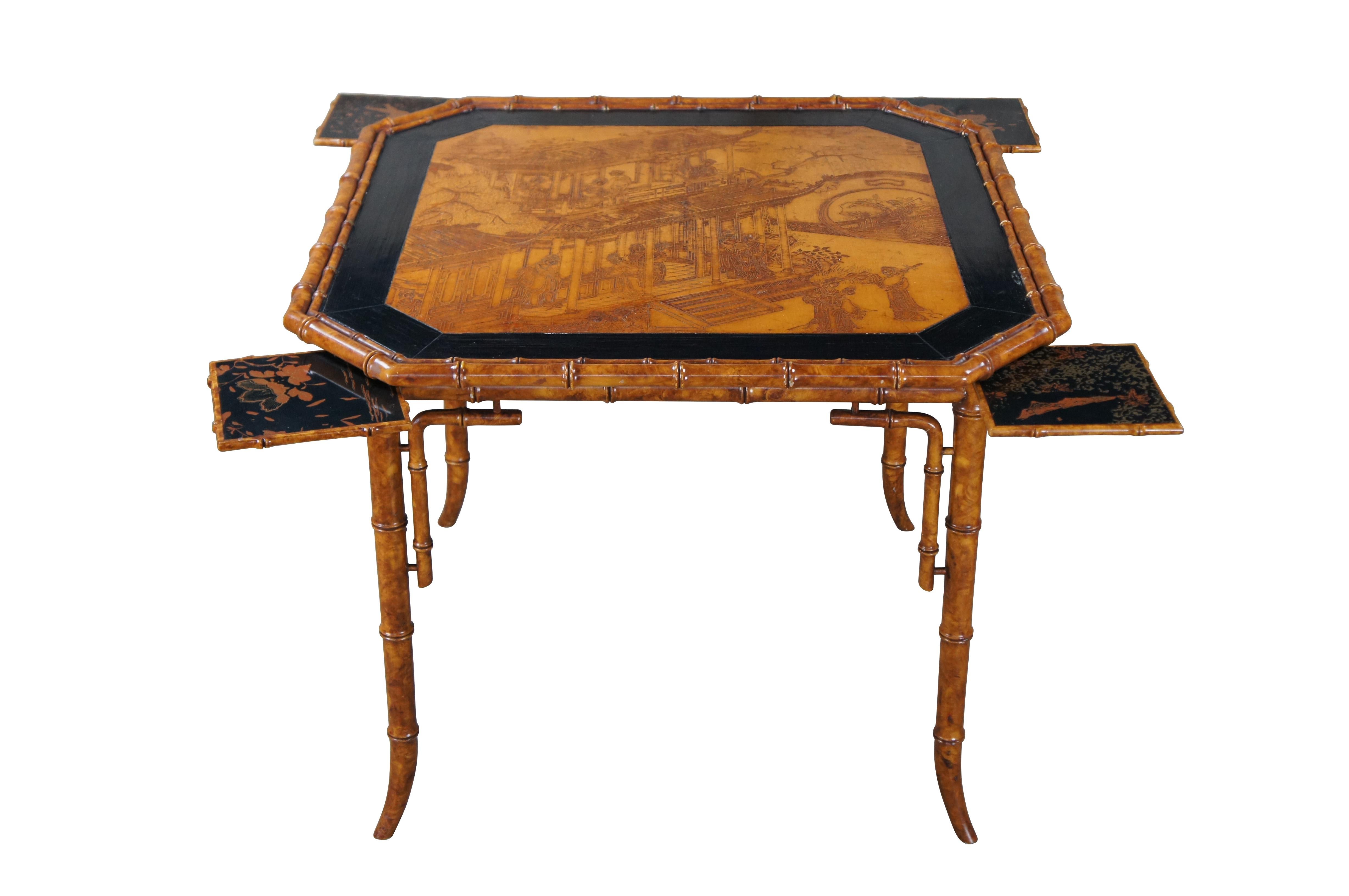 Mid 20th century Japanese game or card table featuring faux bamboo and black lacquered design.  The table top features a Japanese Geisha house with large mooongate and fold out trays for drinks or game pieces.

Dimensions:
38