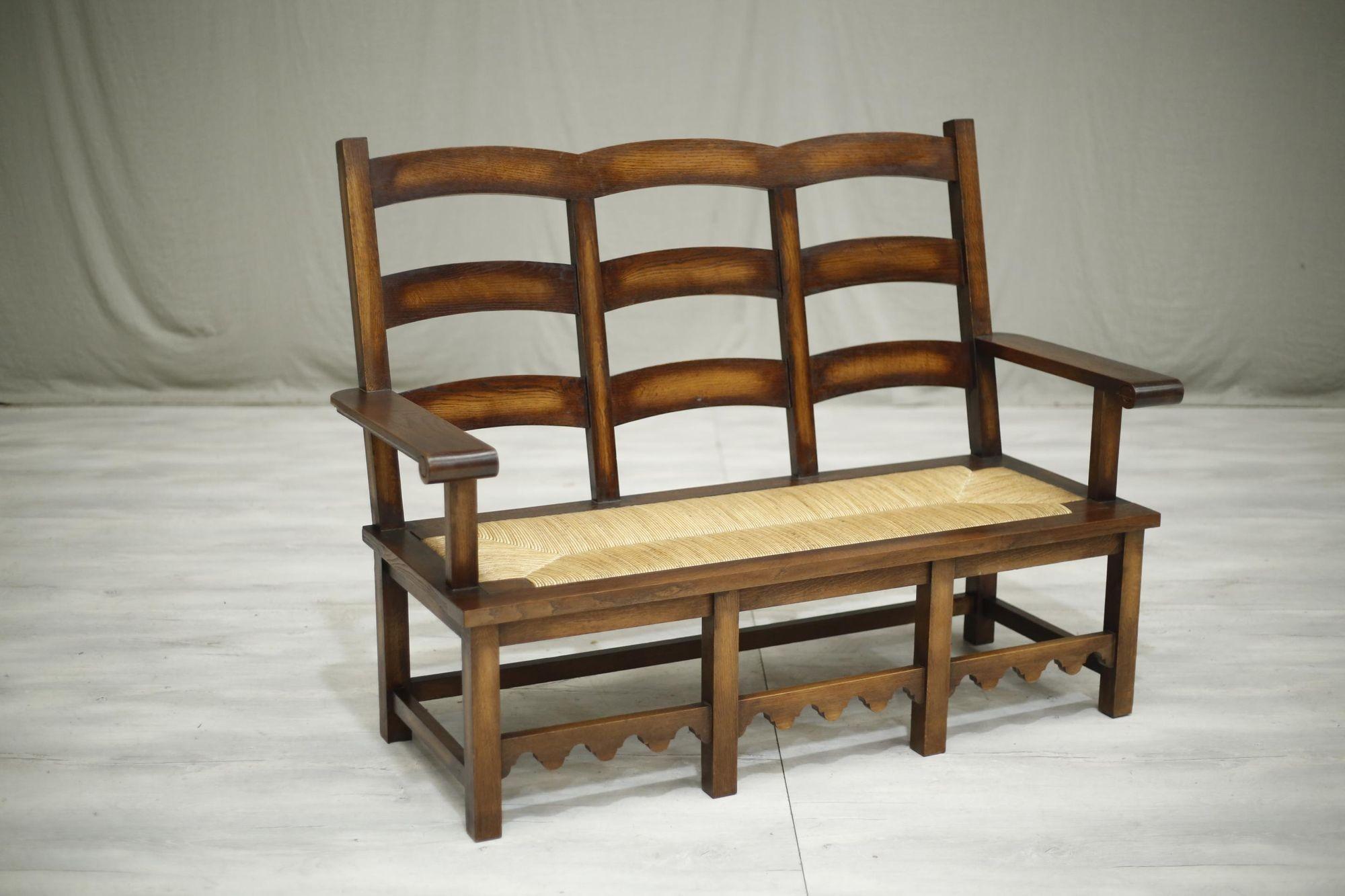 This is a very stylish mid century hall bench. Made from oak and with a rush seat, the quality is fabulous. Overall condition is also great with lovely aged patina all over. The size makes this an ideal statement piece in a hallway or bedroom. The