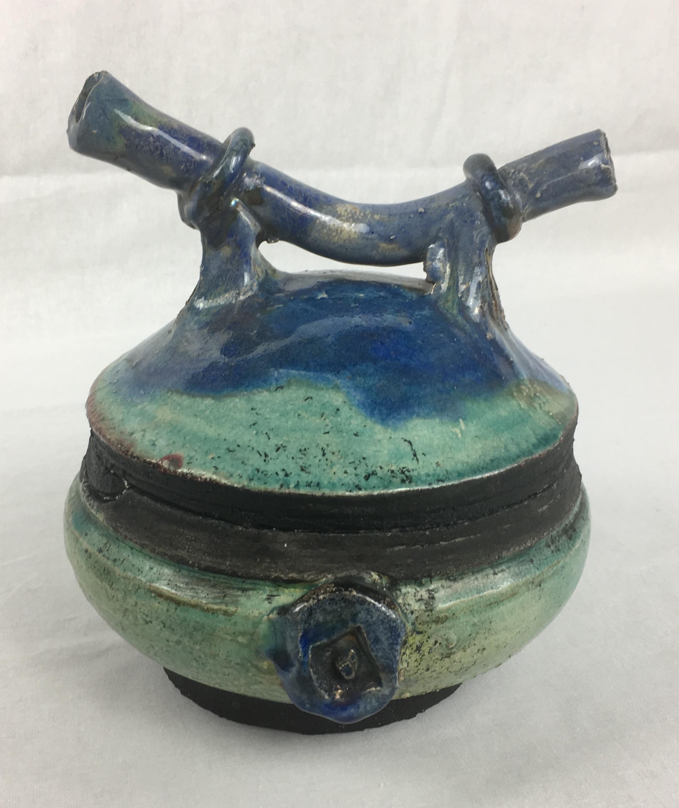 A fine decorative object French inspired by Japanese pottery designs with wonderful prominent blue/green hues. The shape of the top makes this piece exceptionally interesting. 

Artist/maker's mark on the bottom.
 