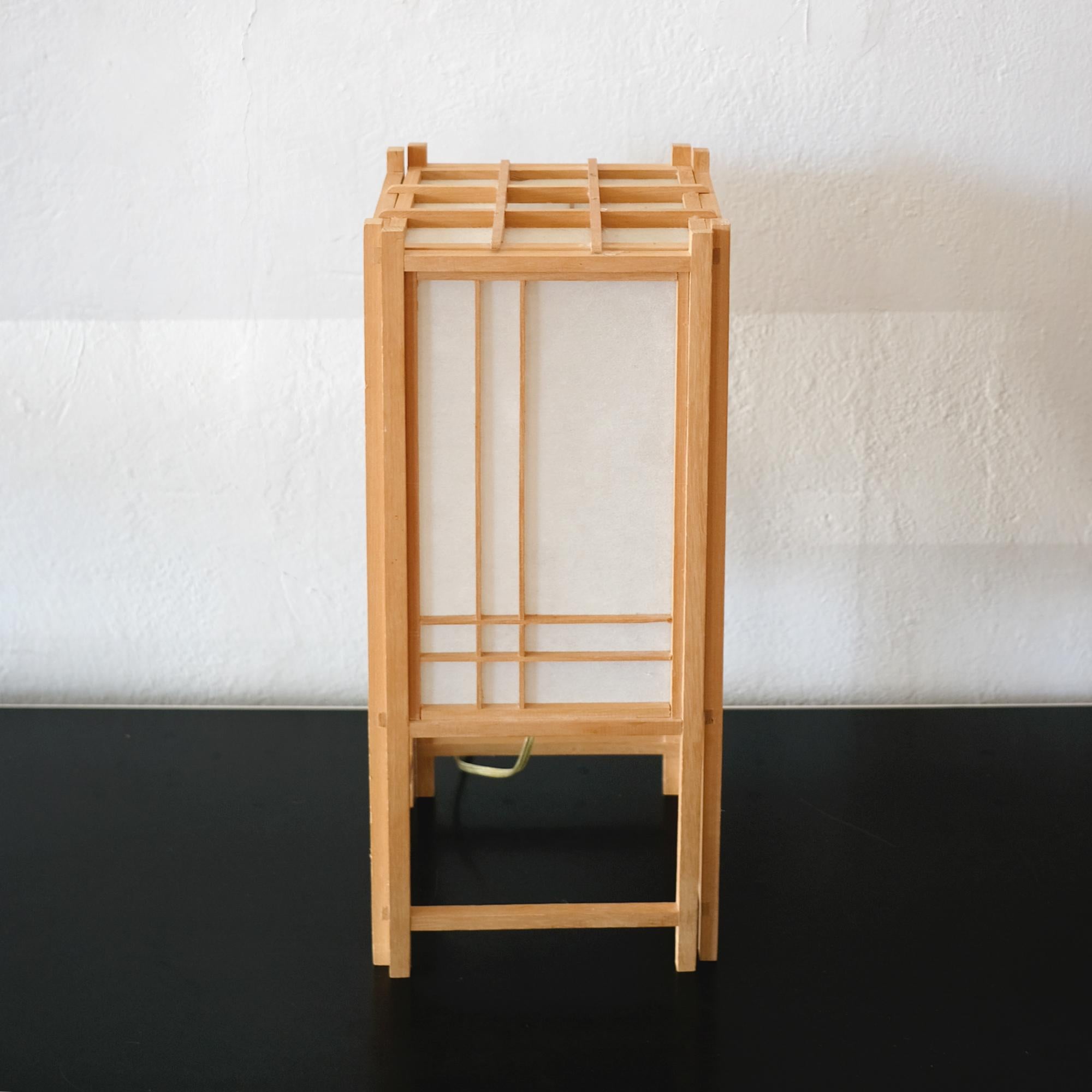 Minimalist Japanese lantern lamp. Wood frame with rice paper shade, 1970s.