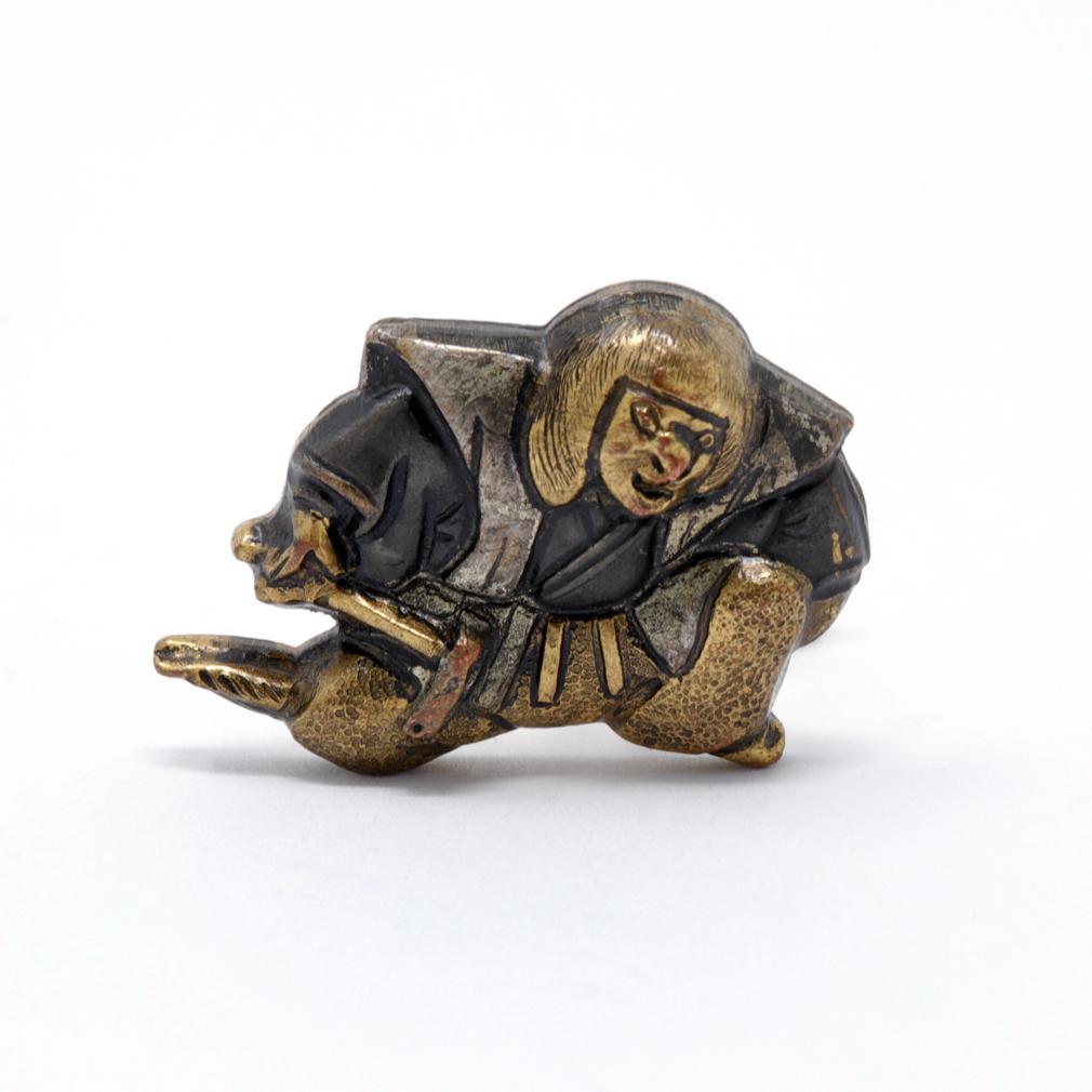 Mid-century Japanese Menuki Cufflinks. Crafted in Japan in Menuki style, a sword handle decoration in Edo period Japan. These cast copper figures were intended as cufflinks and depict the beloved Japanese folklore figures of Shojo, known for having