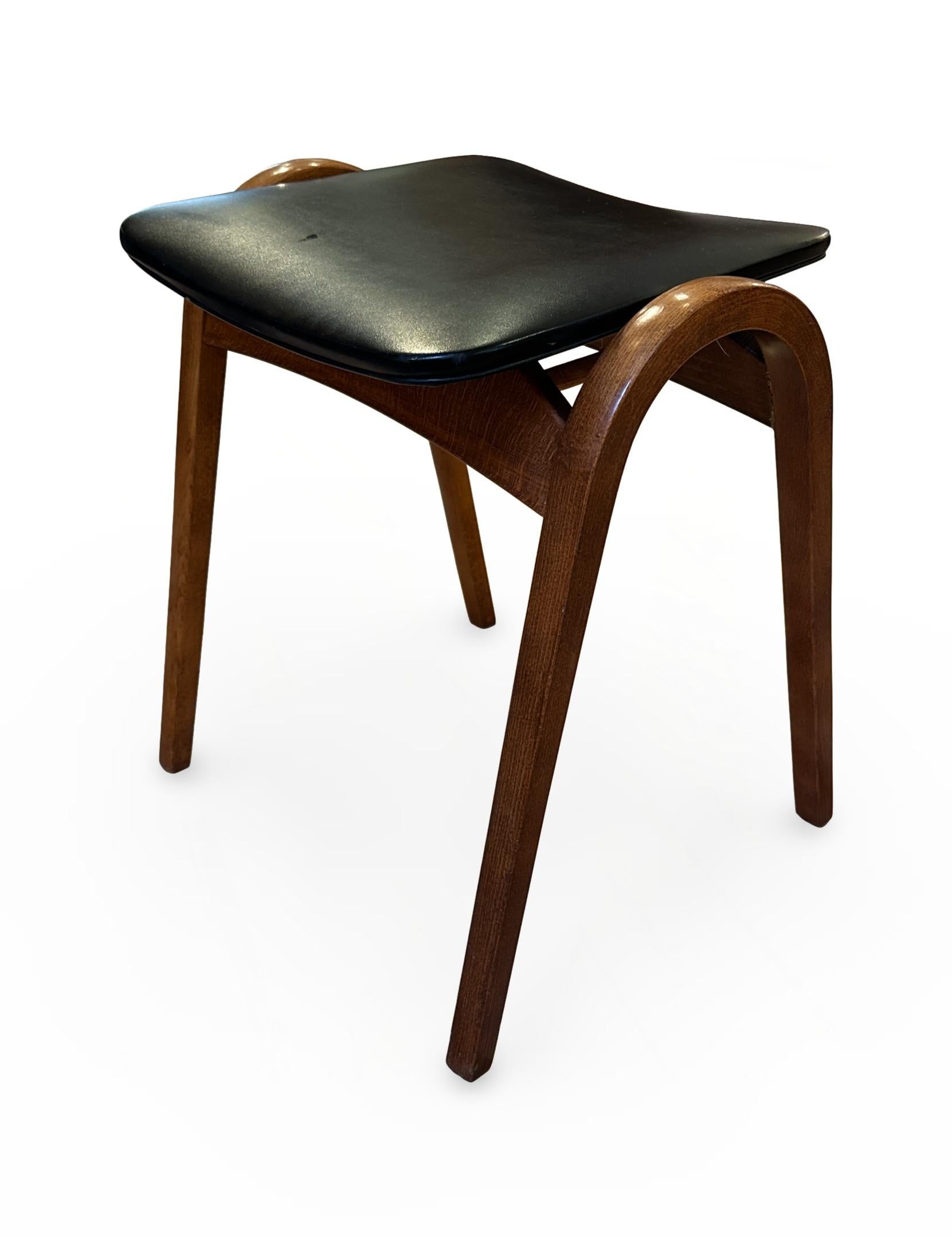 Mid-Century Isamu Kenmochi stacking bentwood Architect Stool, manufactured by Akita Mokko. This piece exemplifies the harmonious blend of functionality and elegant simplicity characteristic of Japanese mid-century design. The stool showcases clean