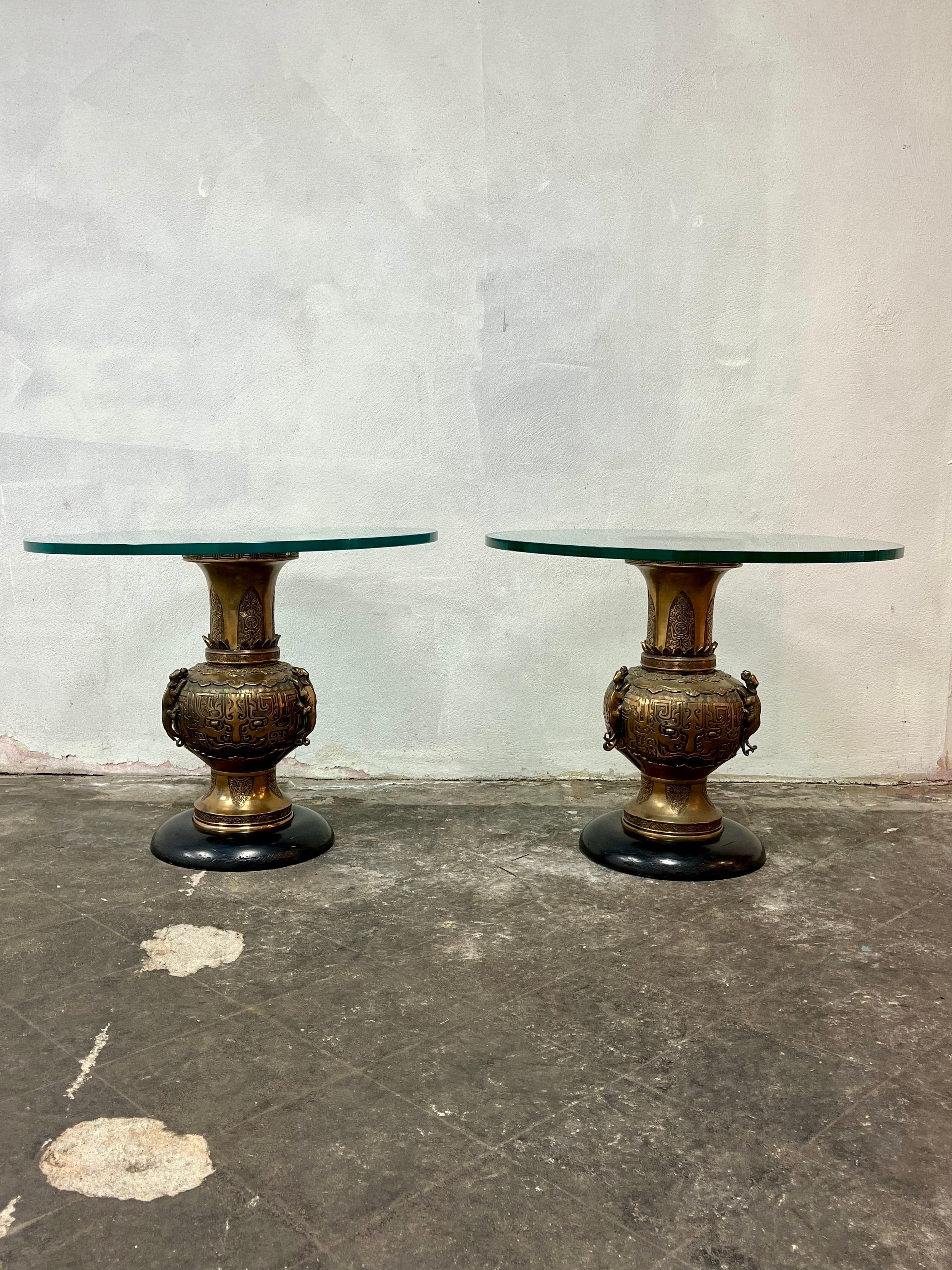 Beautiful pair of Mid Century Japanese Vase tables with a James Mont flair. Great deep detailing in base and nicely balance atop soft rounded wood base. Thick 3/4” glass tops. 
Curbside to NYC/Philly $400