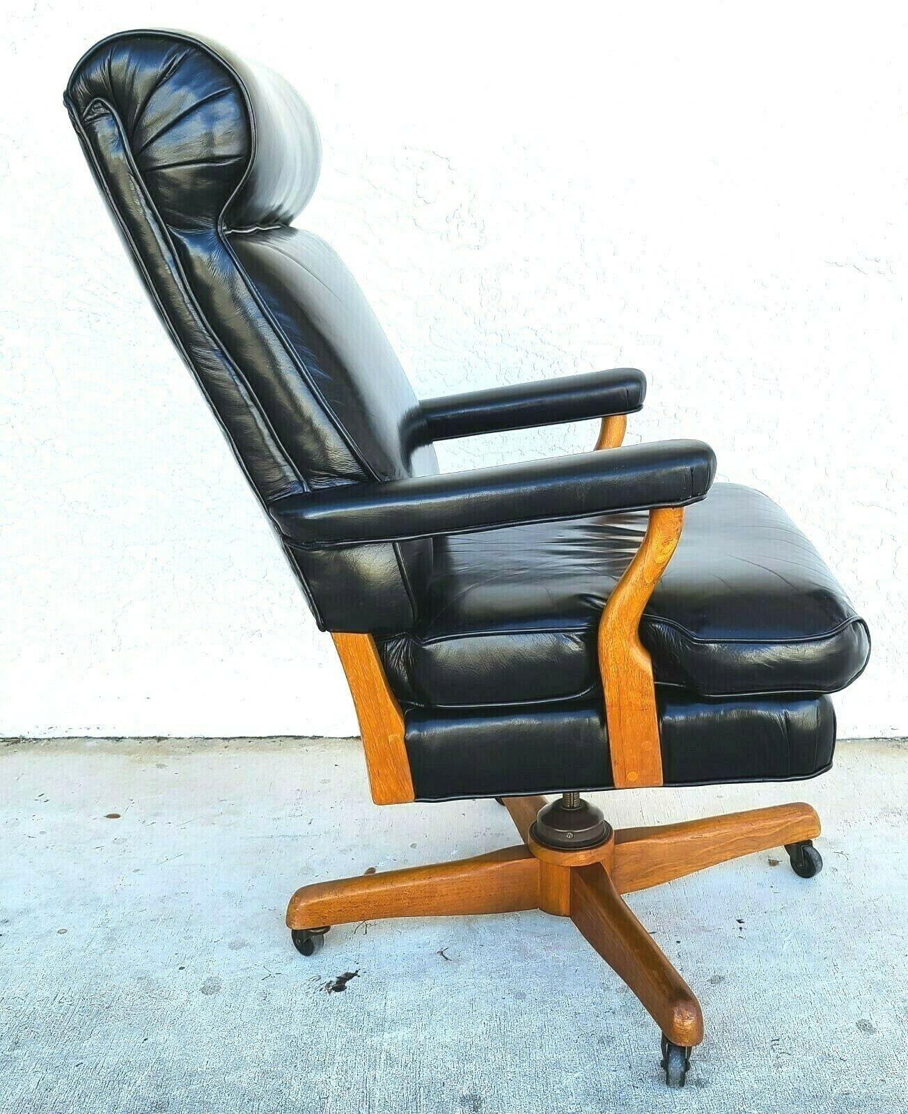 Offering One Of Our Recent Palm Beach Estate Fine Furniture Acquisitions Of A 
Mid Century JFK GUNLOCKE Style Leather Judiciary Executive Office Chair
With casters, Full Swivel, adjustable height, and adjustable tilt features

Approximate