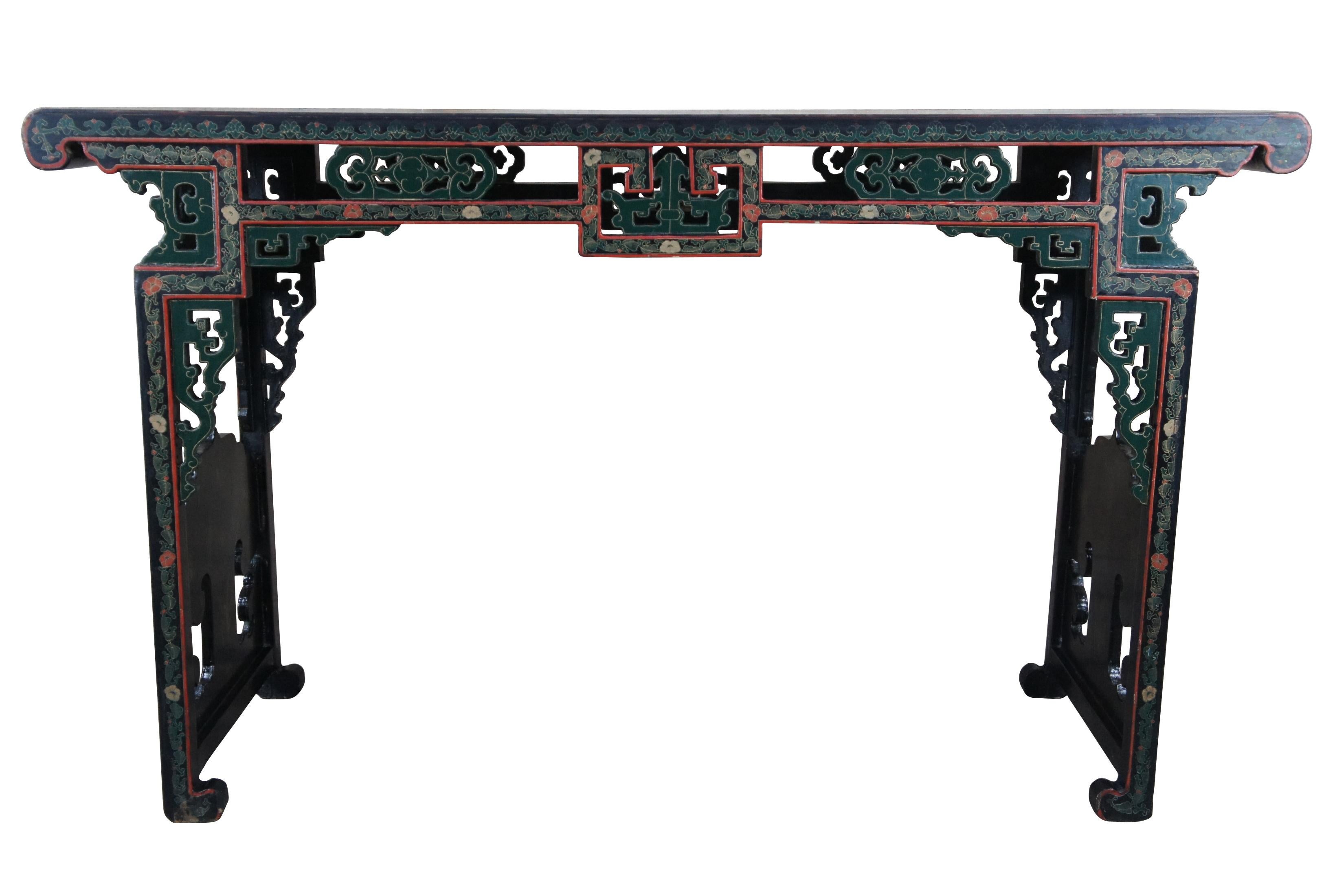 Vintage Jinlong Ming style altar console table featuring reticulated accents with a floral rose bamboo and bird scene with black lacquered field and vibrant greens and reds. 

Made in the Beijing Gold Inlaid Lacquer Furniture Factory.