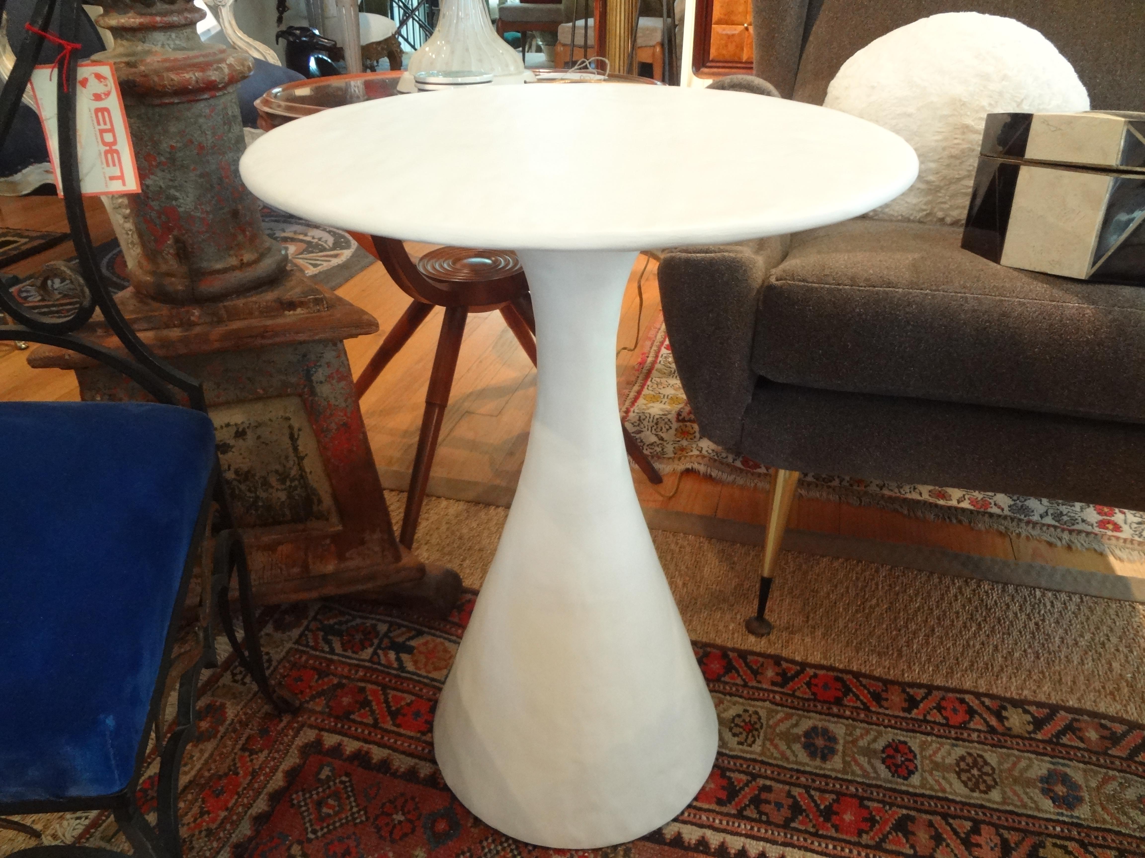 Stunning midcentury plaster table, side table, drink table, cigarette table or gueridon in the style of John Dickinson, Sirmos, Serge Roche, Dorothy Draper, Frances Elkins or Steve Chase. This great table would work well in a variety of interiors.