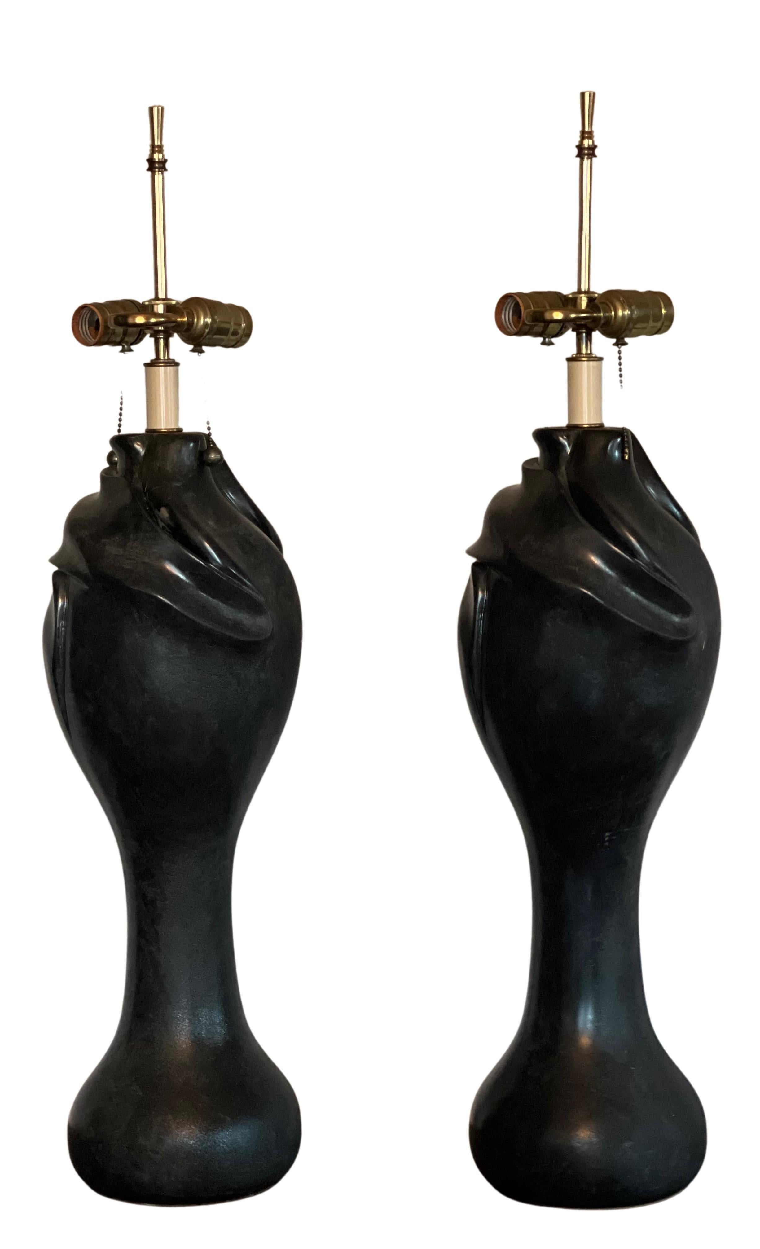 Elegant mid-century Jugenstil style free-form black faux stone table lamps.

The pair has a flowing, foliate organic form found in many of the original Art Nouveau and Jugenstil pieces from the late 19th to early 20th centuries. They are crafted