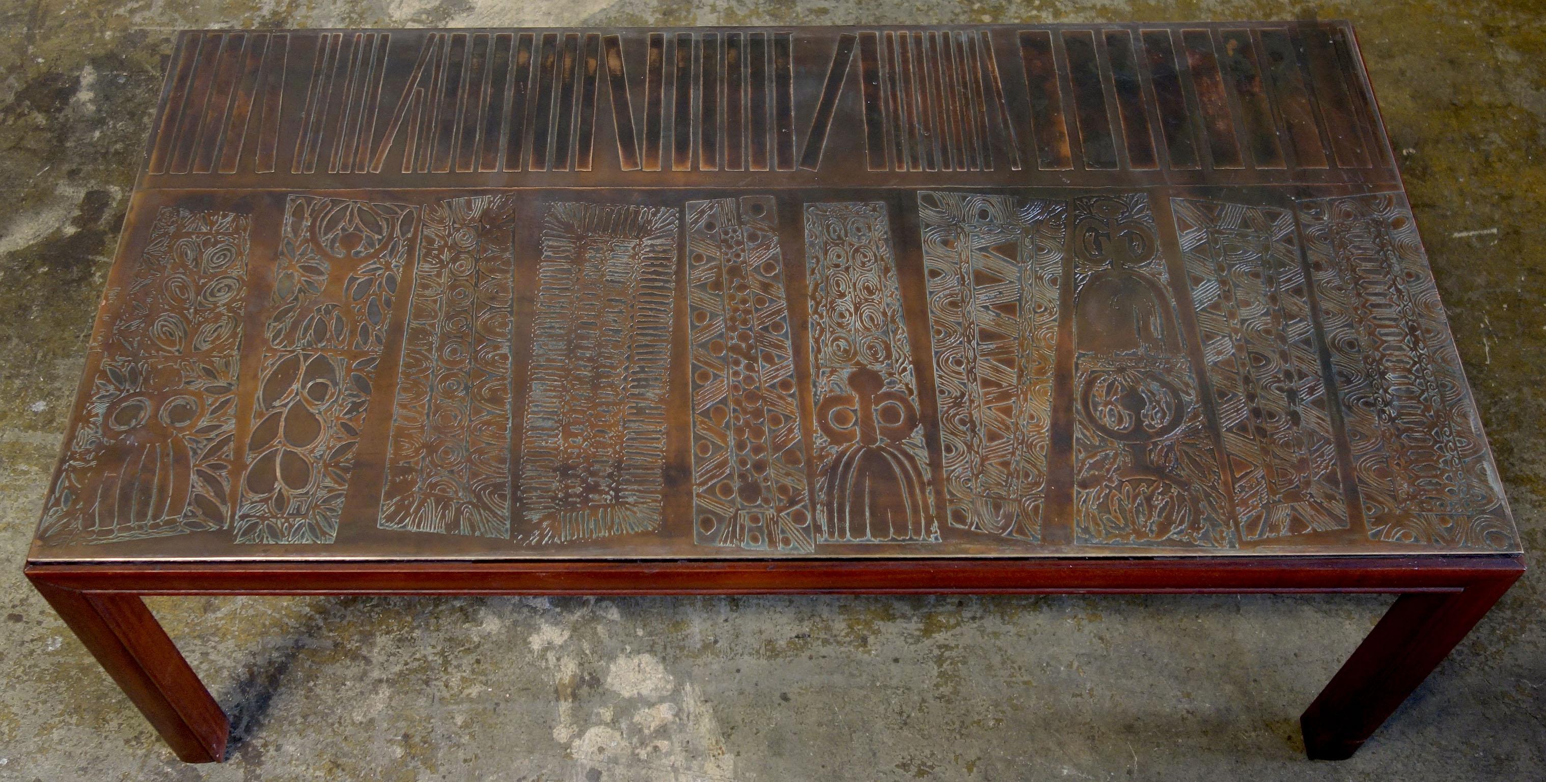 Gorgeous coffee table featuring a copper etched top inserted on a wood table. Jules Heumann incorporated these beautifully etched copper / brass plates 