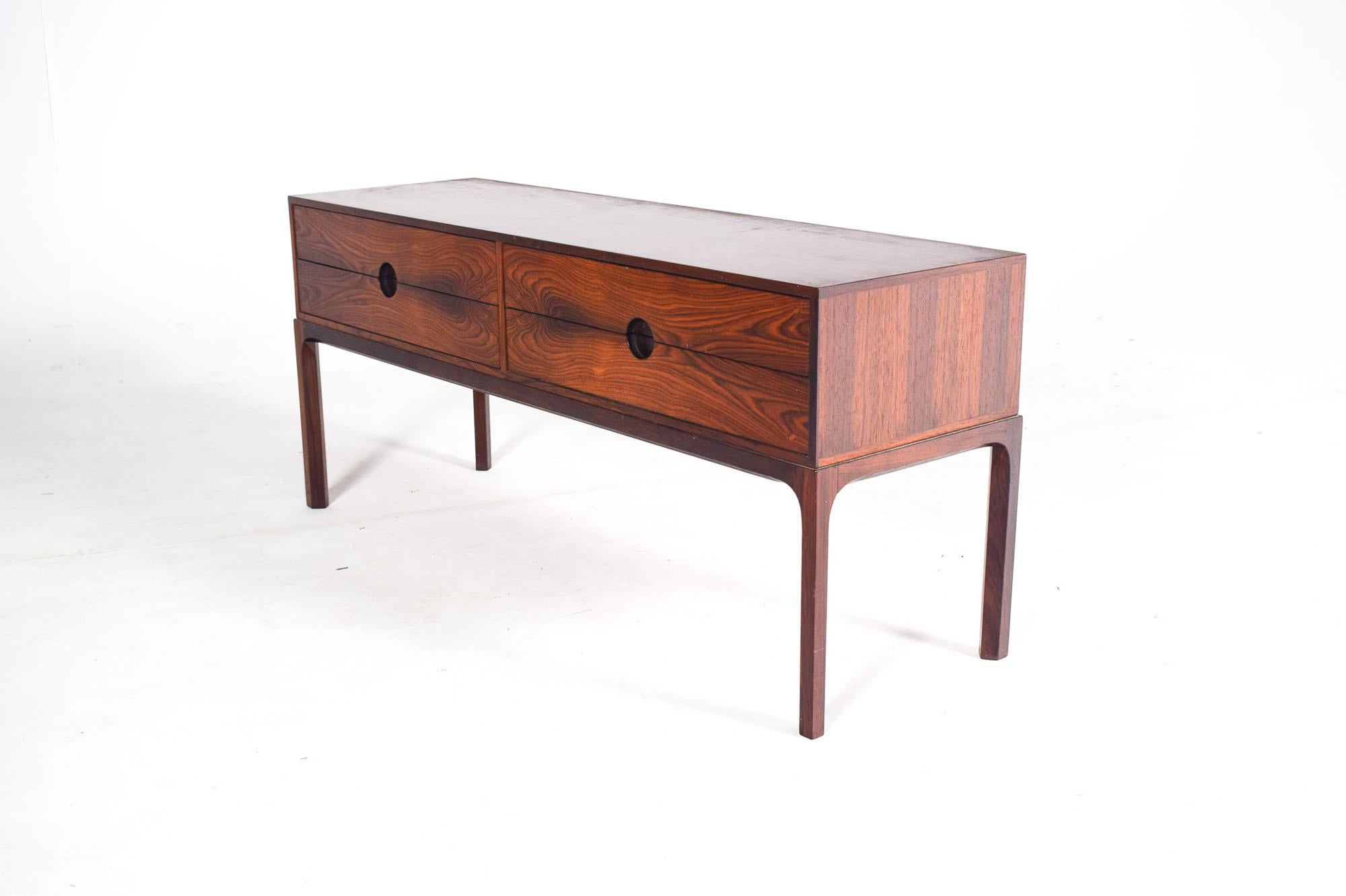 This rosewood low sideboard or side table model no. 394, designed by famous Danish designer Kai Kristiansen and manufactured Aksel Kjersgaard, will add charm to your home. The sideboard’s design follows in the vein of Scandinavian functionality,