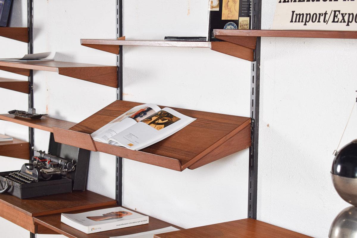 A superb Danish teak wall unit system, designed by Kai Kristiansen for Feldballes Mobelfabrik, from the 1960s. This has many wonderful features, with eleven shelves, four door cabinets and a two drawer writing desk. All can be interchanged and