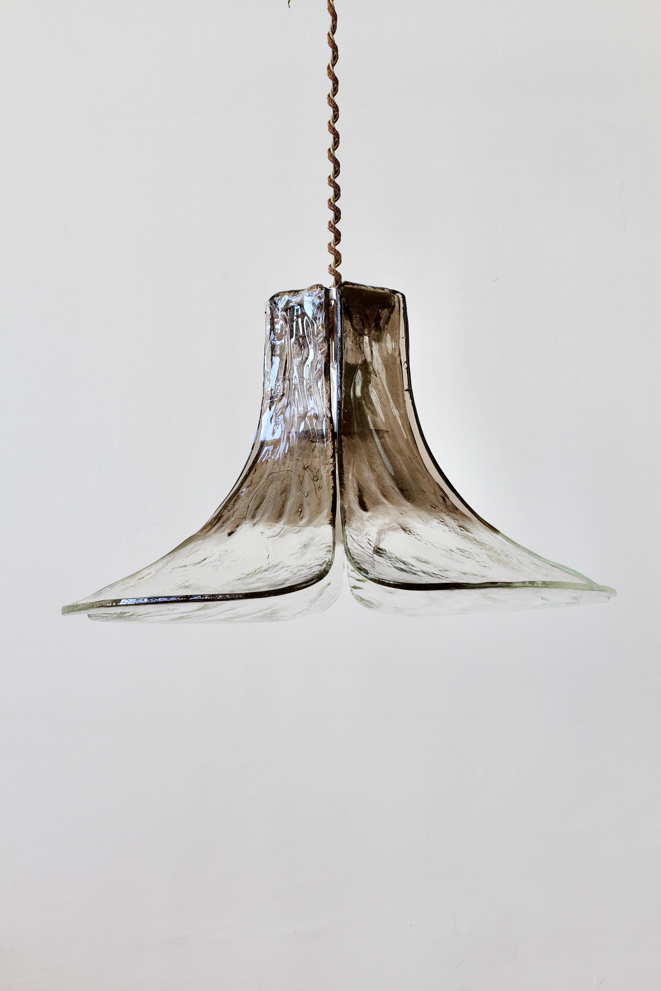 Large (62cm in diameter) vintage midcentury smoked and clear glass hanging pendant lamp or light fixture by Austrian lighting manufacturer Kalmar, circa late 1970s. Featuring three large curved flower petal shaped glass elements, made by Italian