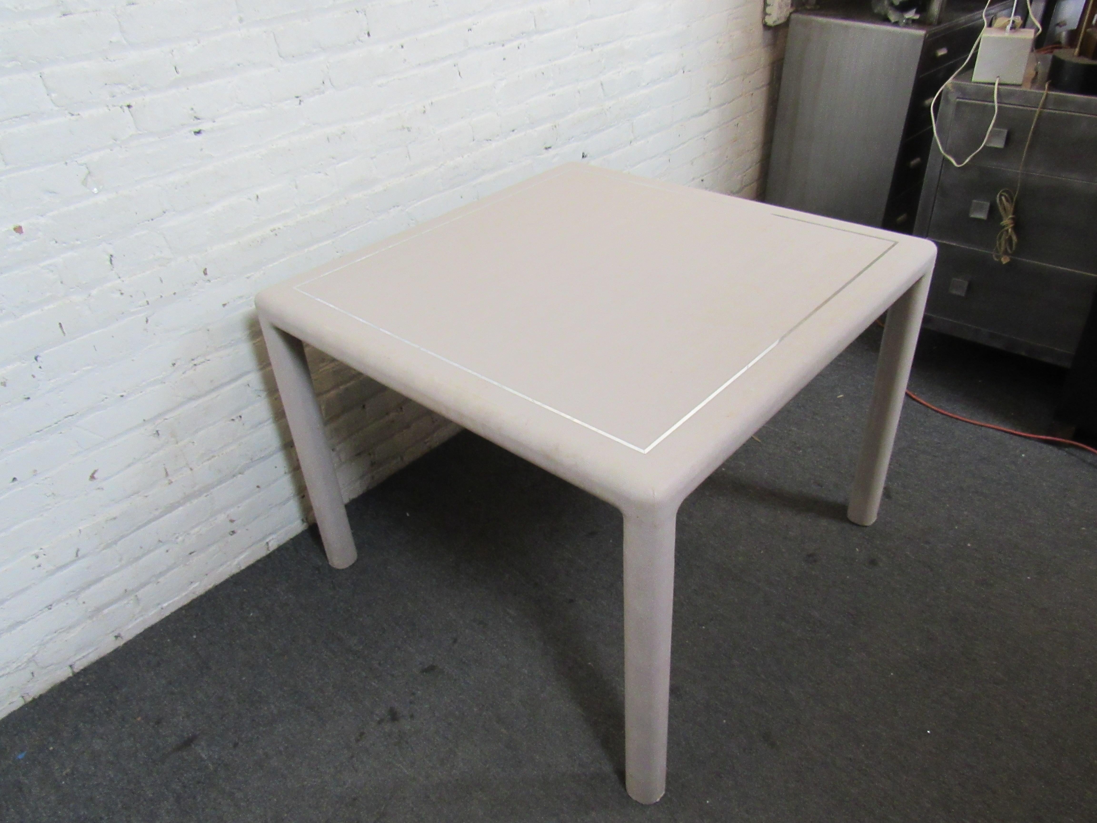 Wild pale-pink snakeskin table with slight chrome trim. Perfect for a small dining table.
(Please confirm item location - NY or NJ - with dealer).
 