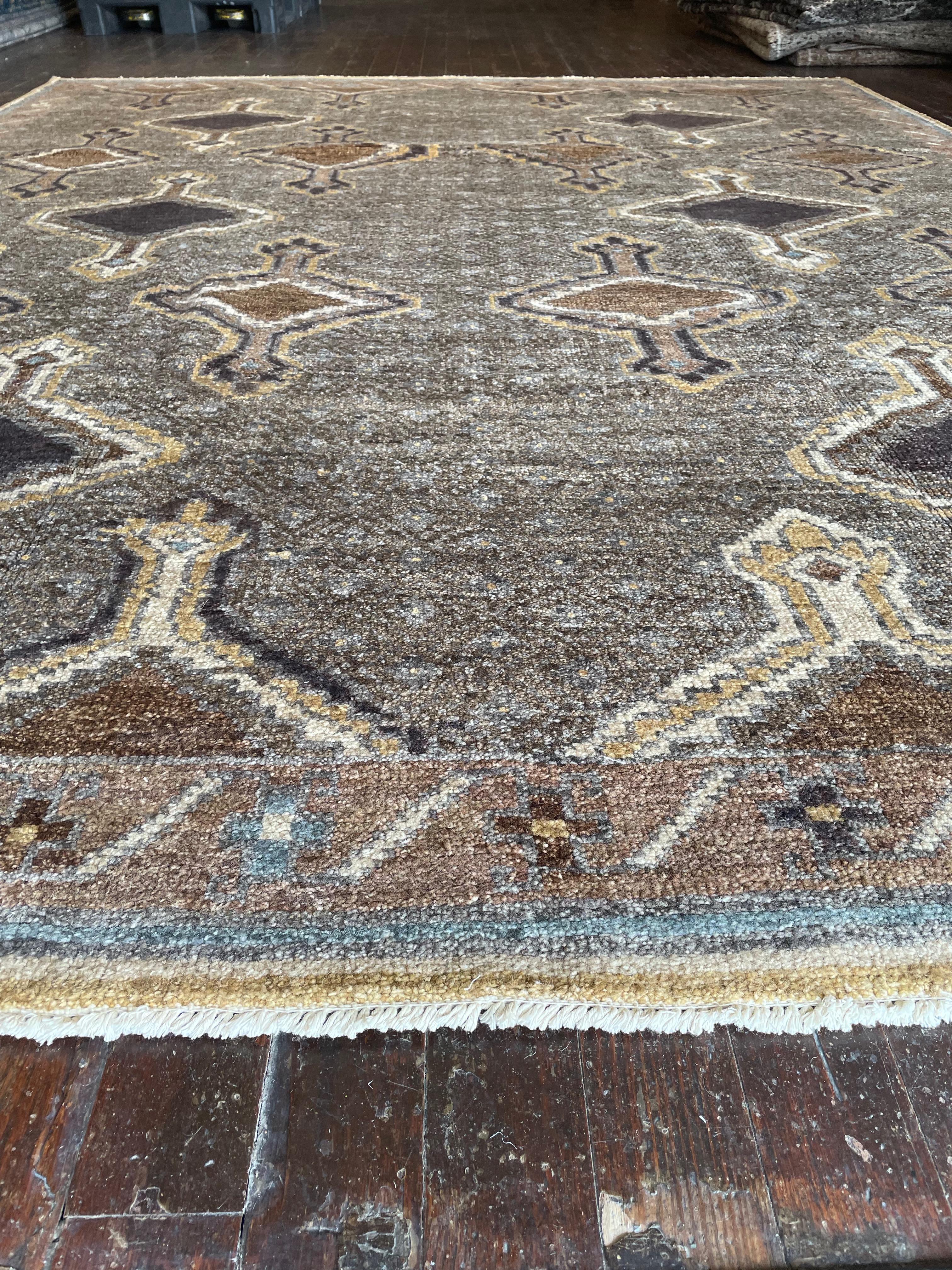 Step into a world of timeless beauty with this exquisite reproduction of a Kars rug, meticulously hand-knotted in Pakistan. Originally hailing from the Kars region in Eastern Anatolia, Turkey, Kars rugs are celebrated for their intricate geometric