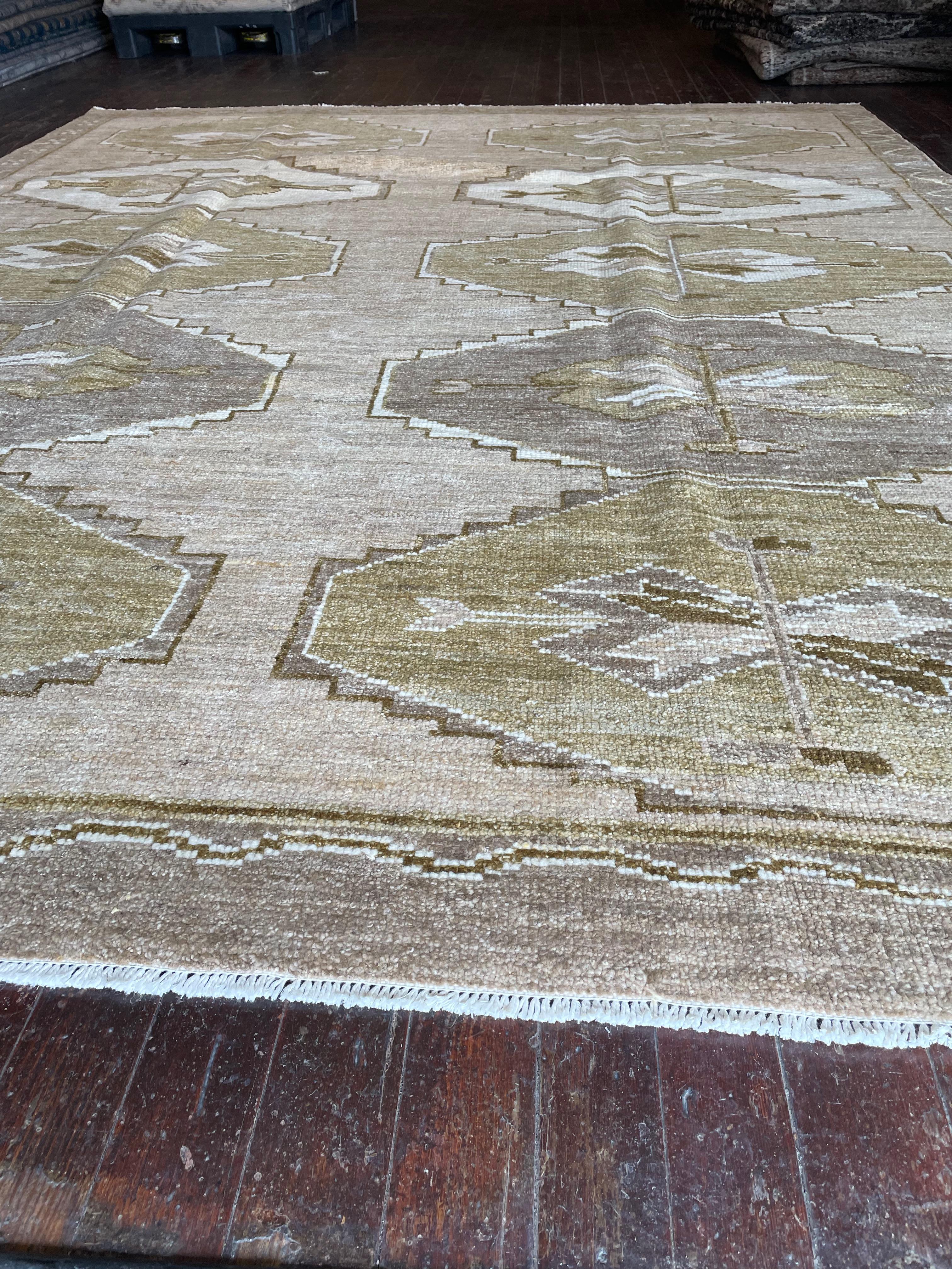 Step into a world of timeless beauty with this exquisite reproduction of a Kars rug, meticulously hand-knotted in Pakistan. Originally hailing from the Kars region in Eastern Anatolia, Turkey, Kars rugs are celebrated for their intricate geometric