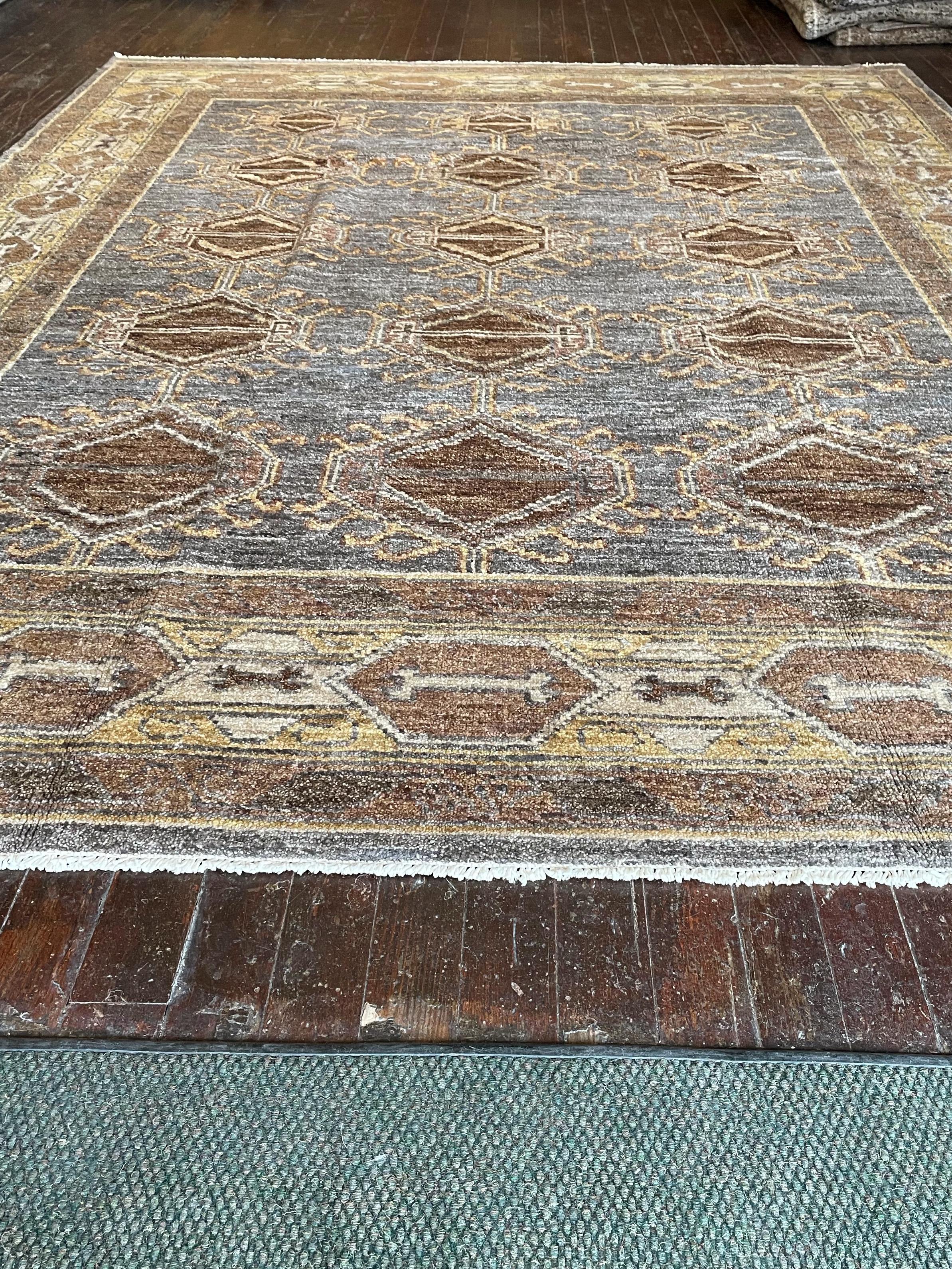 Step into a world of timeless beauty with this exquisite reproduction of a Kars rug, meticulously hand-knotted in Pakistan. Originally hailing from the Kars region in Eastern Anatolia, Turkey, Kars rugs are celebrated for their intricate geometric