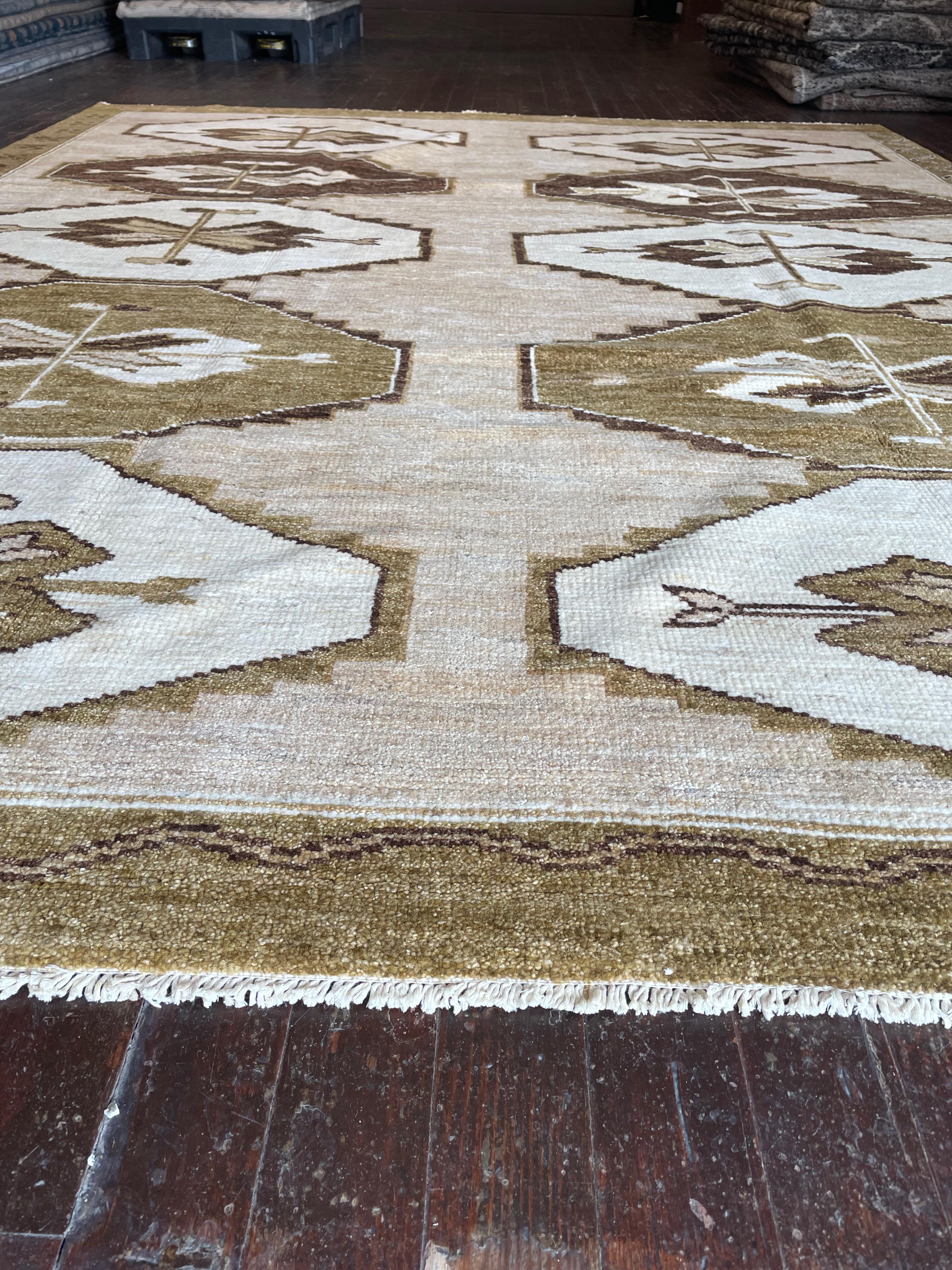 Step into a world of timeless beauty with this exquisite reproduction of a Kars rug, meticulously hand-knotted in Pakistan. Originally hailing from the Kars region in Eastern Anatolia, Turkey, Kars rugs are celebrated for their intricate geometric