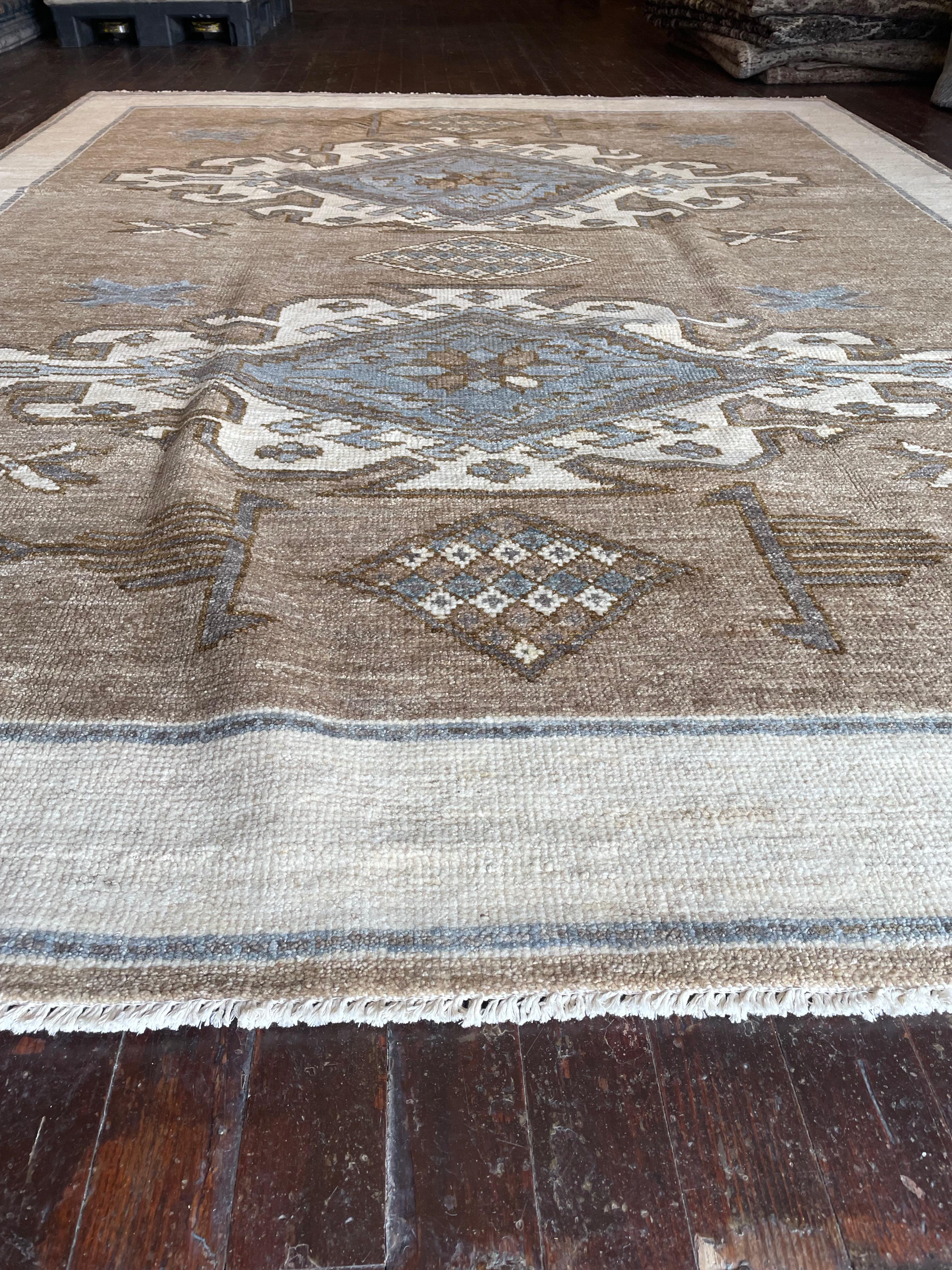 Step into a world of timeless beauty with this exquisite reproduction of a Kars rug, meticulously hand-knotted in Pakistan. Originally hailing from the Kars region in Eastern Anatolia, Turkey, Kars rugs are celebrated for their intricate geometric