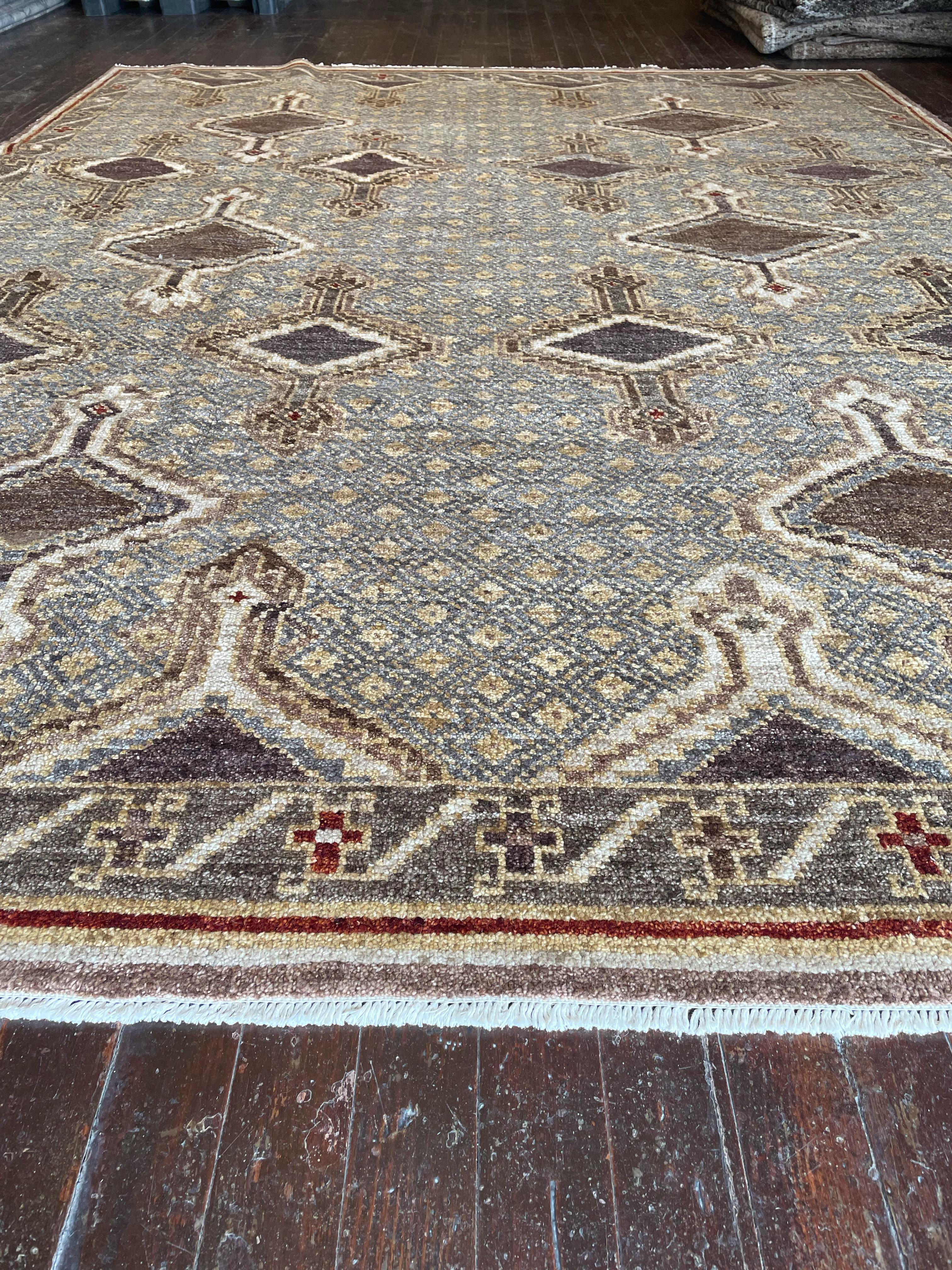 Step into a world of timeless beauty with this exquisite reproduction of a Kars rug, meticulously hand-knotted in Pakistan. Originally hailing from the Kars region in Eastern Anatolia, Turkey, Kars rugs are celebrated for their intricate geometric