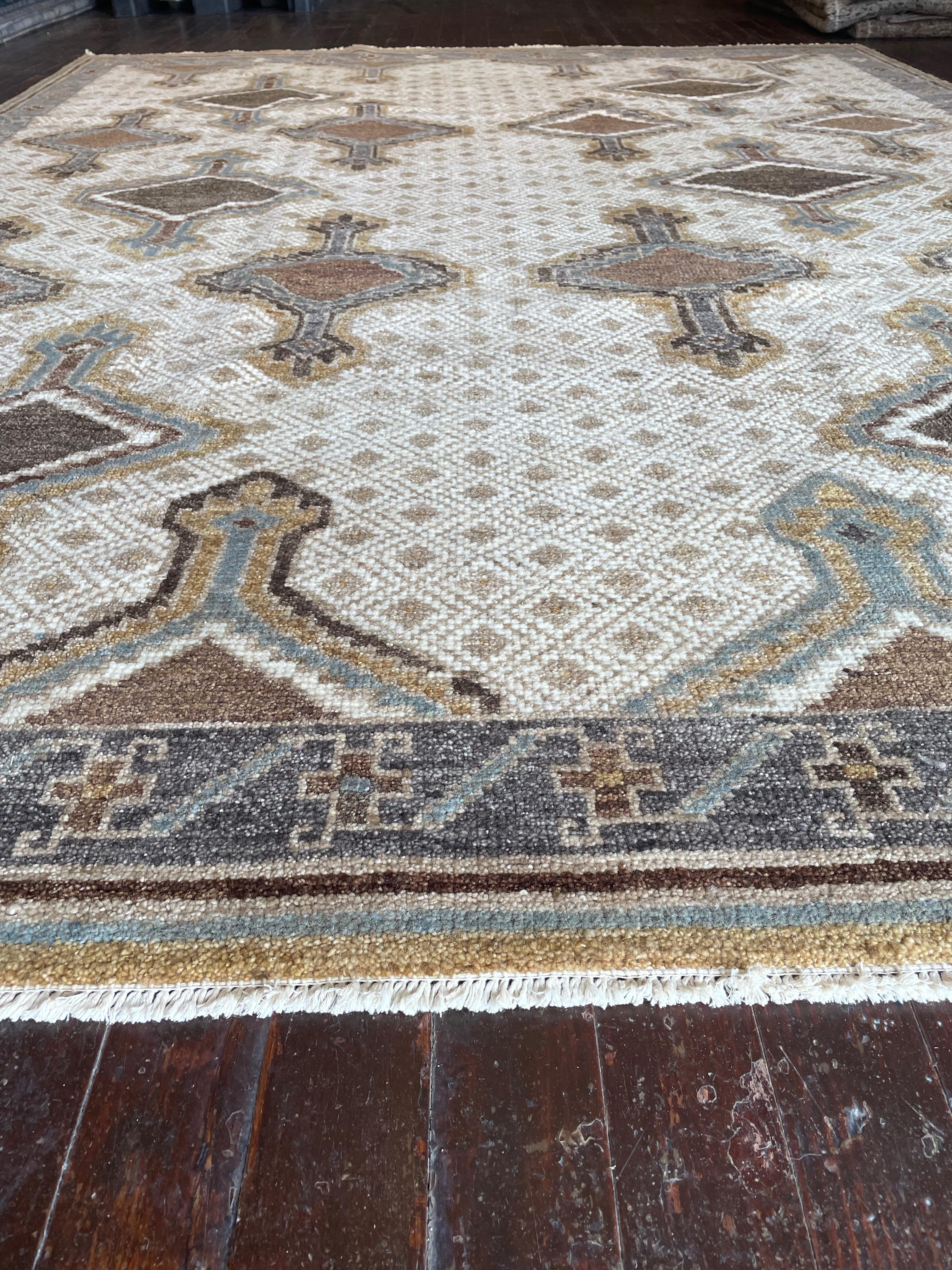 Step into a world of timeless beauty with this exquisite reproduction of a Kars rug, meticulously hand-knotted in Pakistan. Originally hailing from the Kars region in Eastern Anatolia, Turkey, Kars rugs are celebrated for their intricate geometric