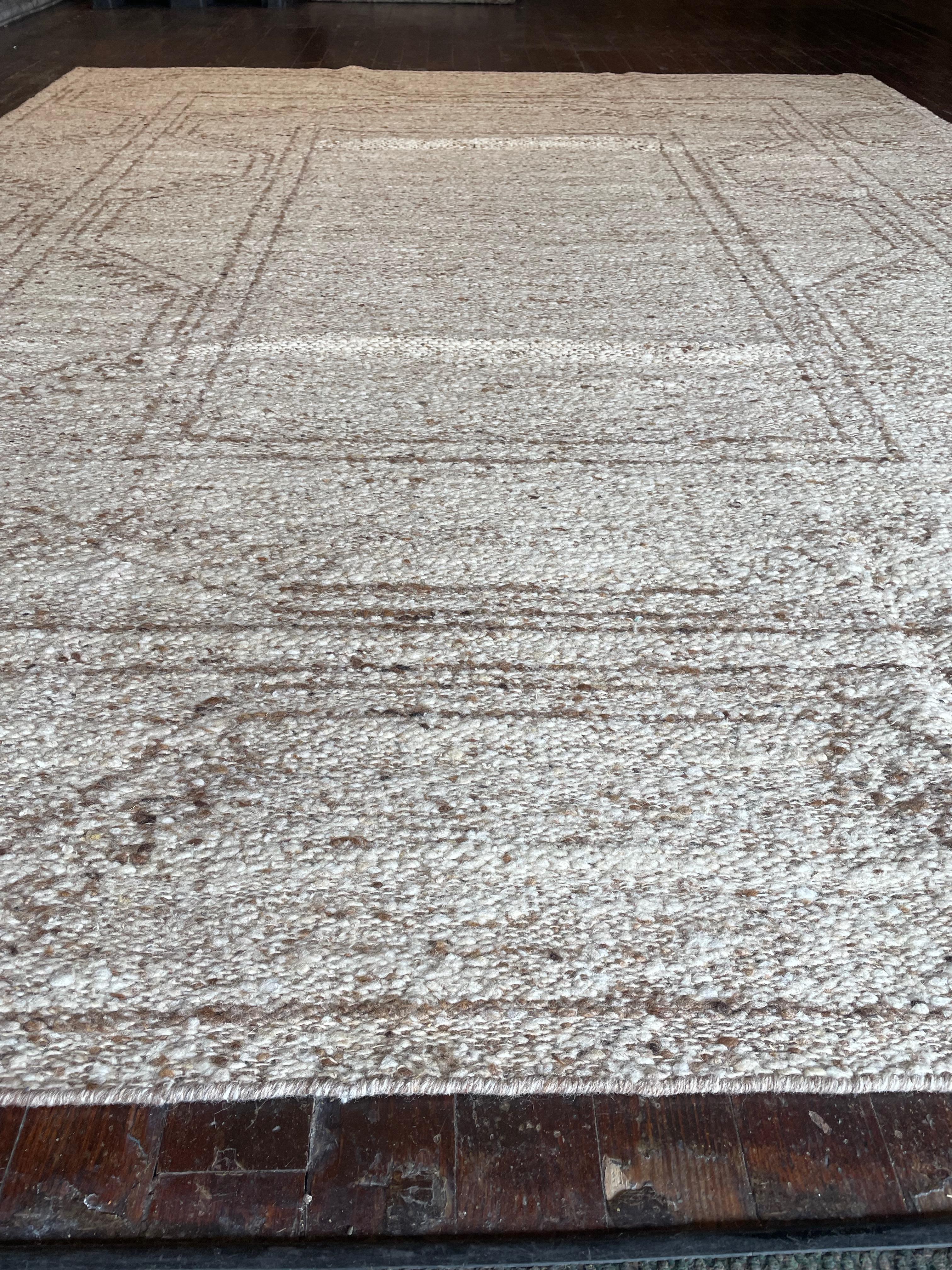 Immerse yourself in the timeless simplicity of this flat weave Kars rug reproduction, meticulously crafted in India. Originating from the Kars region in Eastern Anatolia, Turkey, Kars rugs are renowned for their intricate geometric patterns and deep