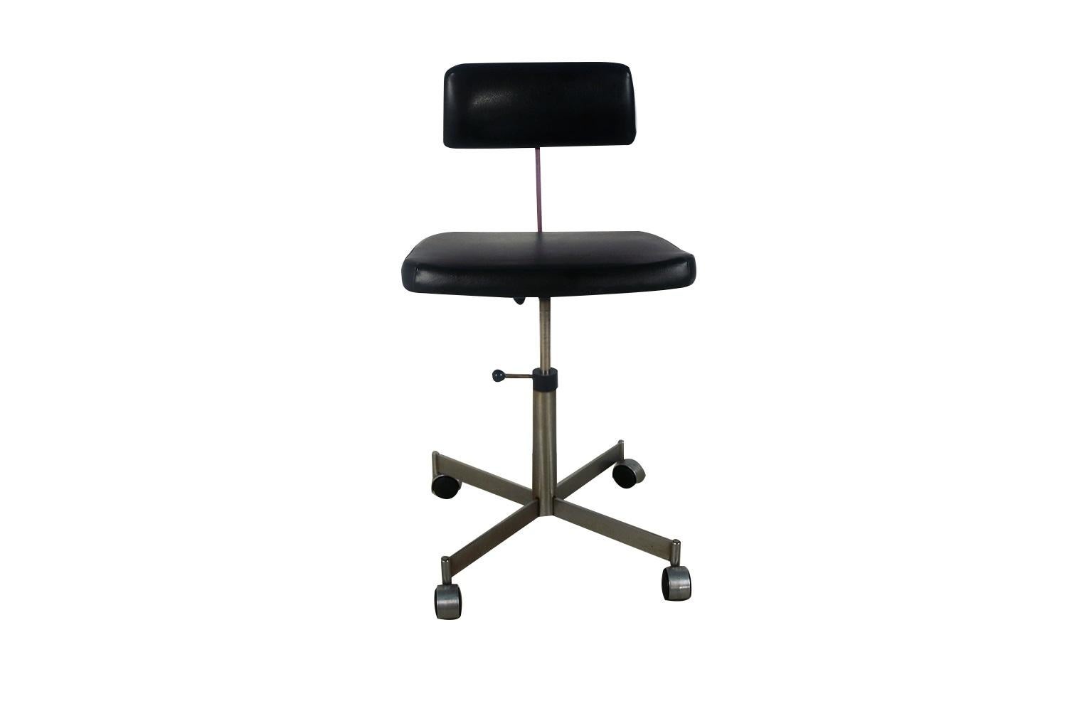 KEVI office chair with double-wheel casters by Jørgen Rasmussen. A Classic Mid-Century Modern office chair, the KEVI was originally designed in 1958 by iconic architect, Jørgen Rasmussen. Designed for the KEVI company this chair was updated 1965