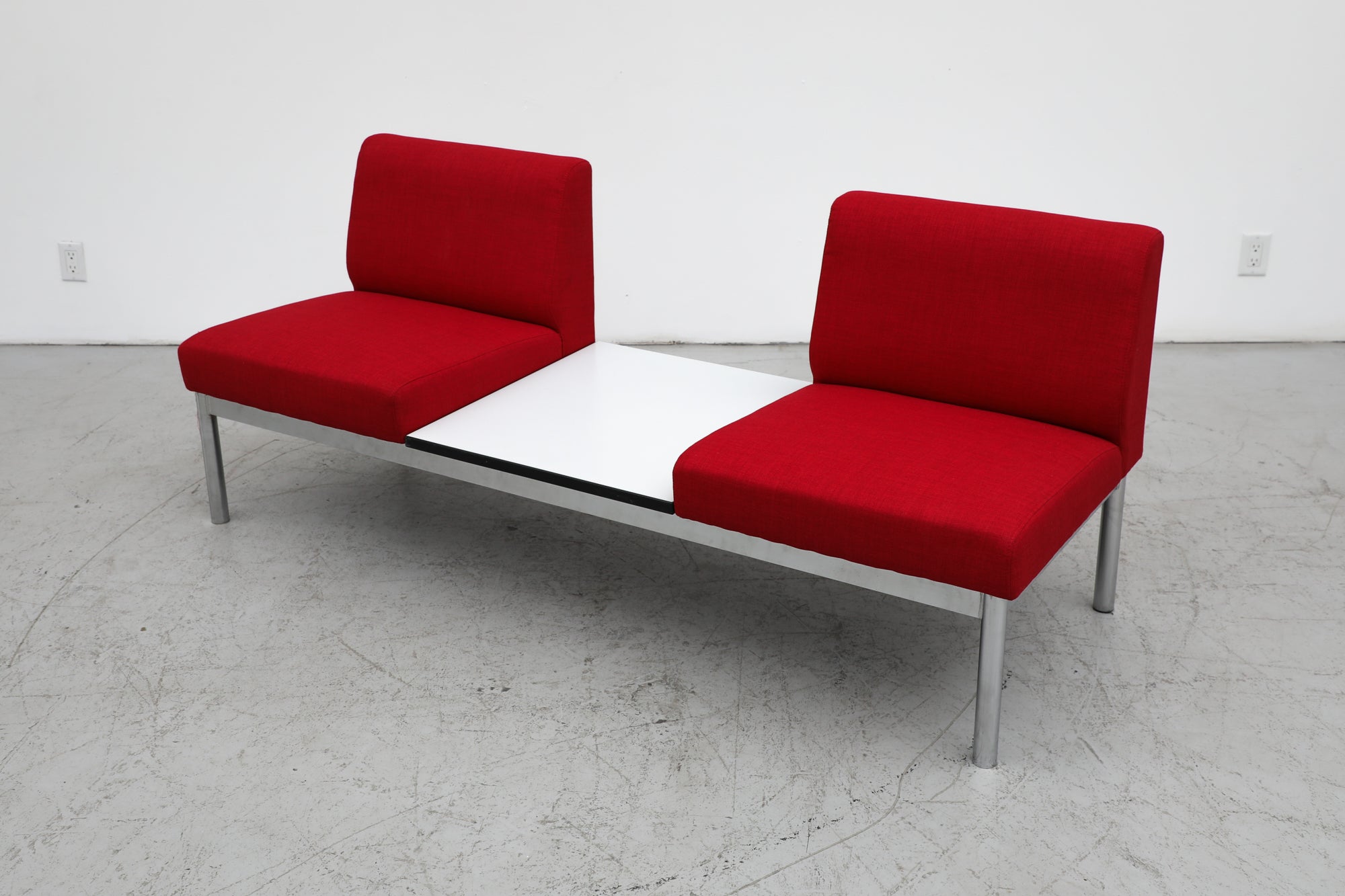 Mid-Century Gelderland style 2 seater loveseat with center table between chairs, chrome frame and newly upholstered red cushions. In original condition with some wear consistent with age and use. Similar sofas also available listed separately (S303).